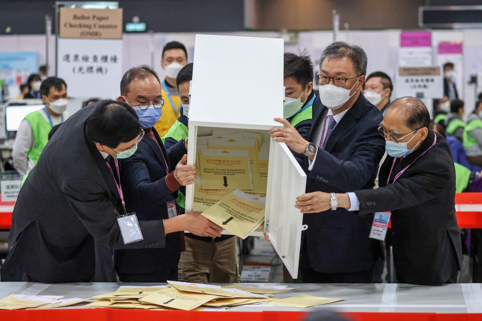 Officials open a ballot box after voting ended on Sunday morning. Photo: SCMP