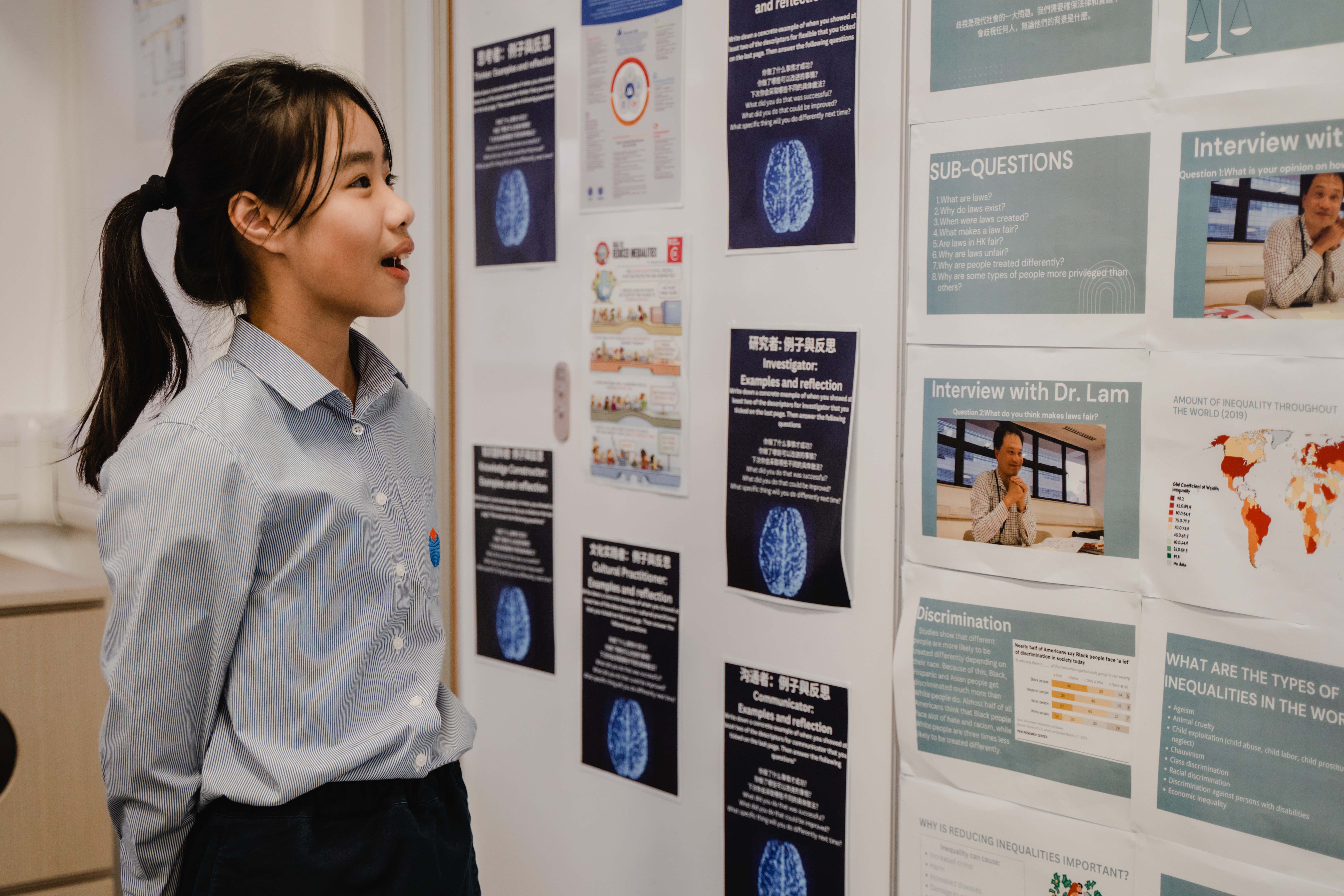 A Year 7 student is explaining her project initiatives to the guests on the Open Day.