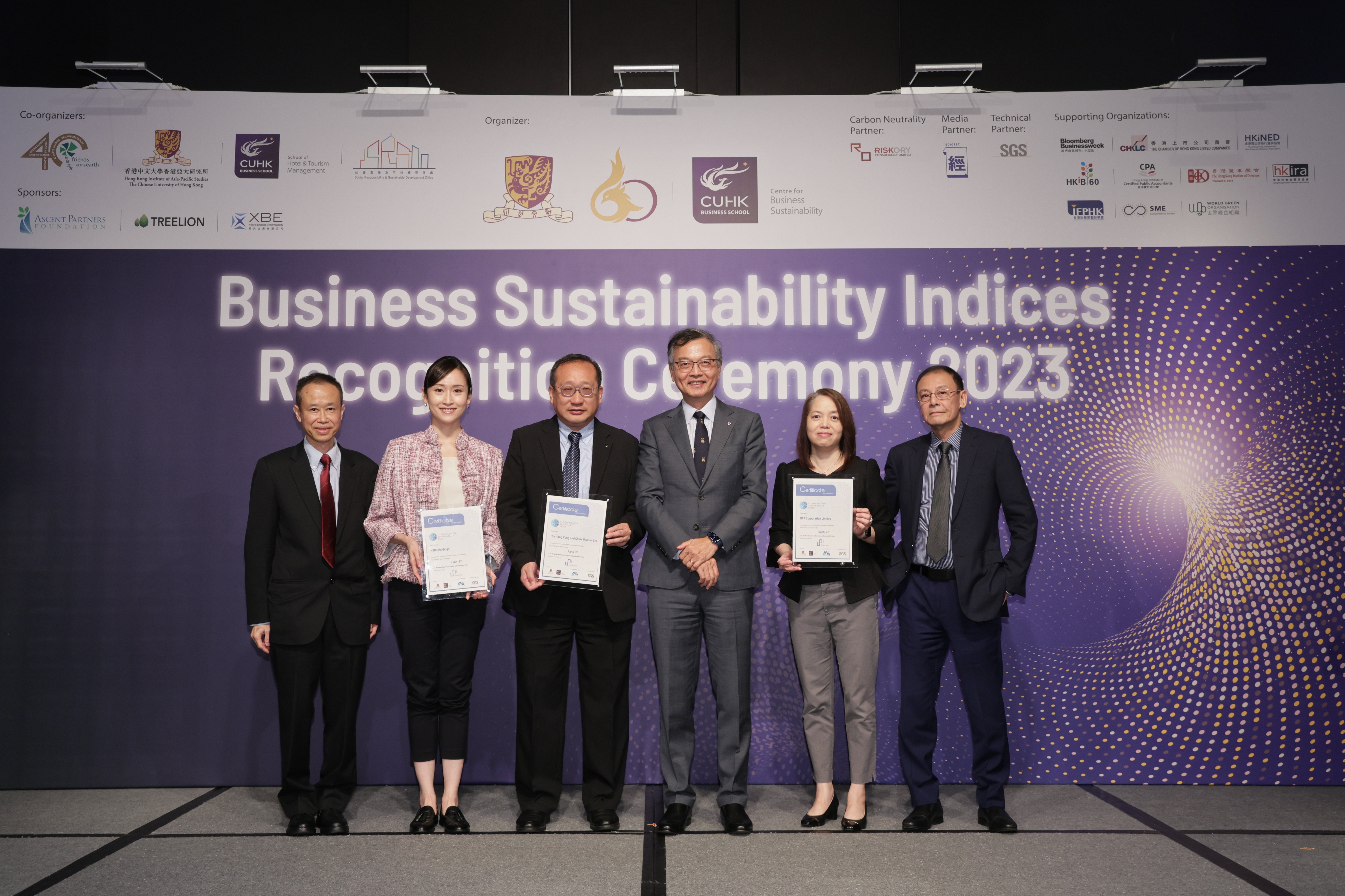 The top three companies of the 1st Global (Asia Pacific) BSI 2023 receive their certificates. From Left: Prof Carlos Lo, Director, Centre for Business Sustainability; Ms Bonnie Yip of The Hongkong and Shanghai Banking Corporation Limited; Mr Lam Ming-wing of The Hong Kong and China Gas Company Limited; Dr the Honorable Lam Ching-choi, Chairman, Council for Carbon Neutrality & Sustainable Development; Ms Jessica Chan of MTR Corporation; Dr Herbert Lee, Honorary Fellow, Centre for Business Sustainability.