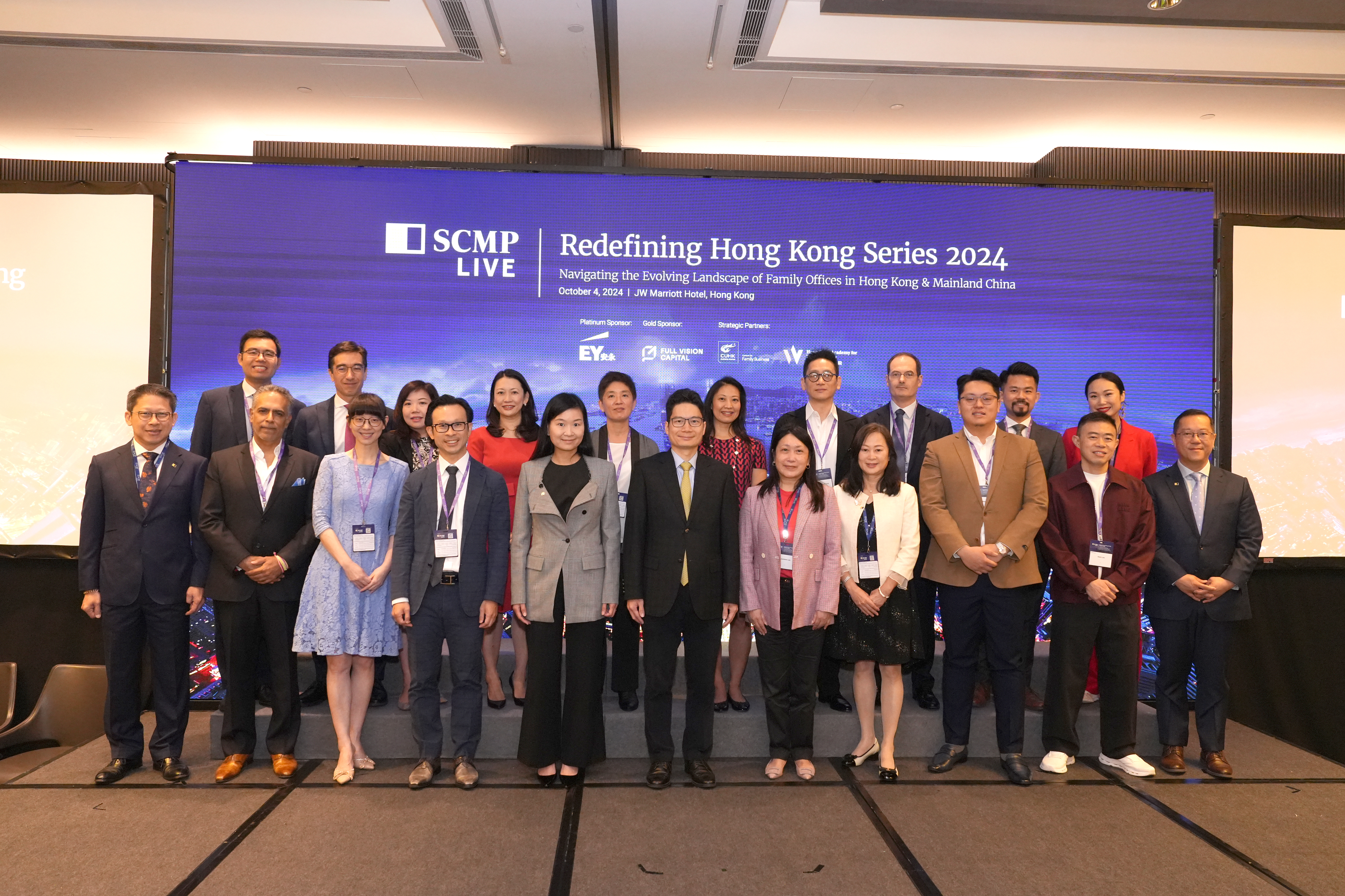 Joseph Chan (center front), the Under Secretary for Financial Services and the Treasury; Jasmine Lee (fifth from right), EY Hong Kong and Macau Managing Partner; and distinguished guests at the SCMP’s Redefining Hong Kong: Family Office conference last week. 