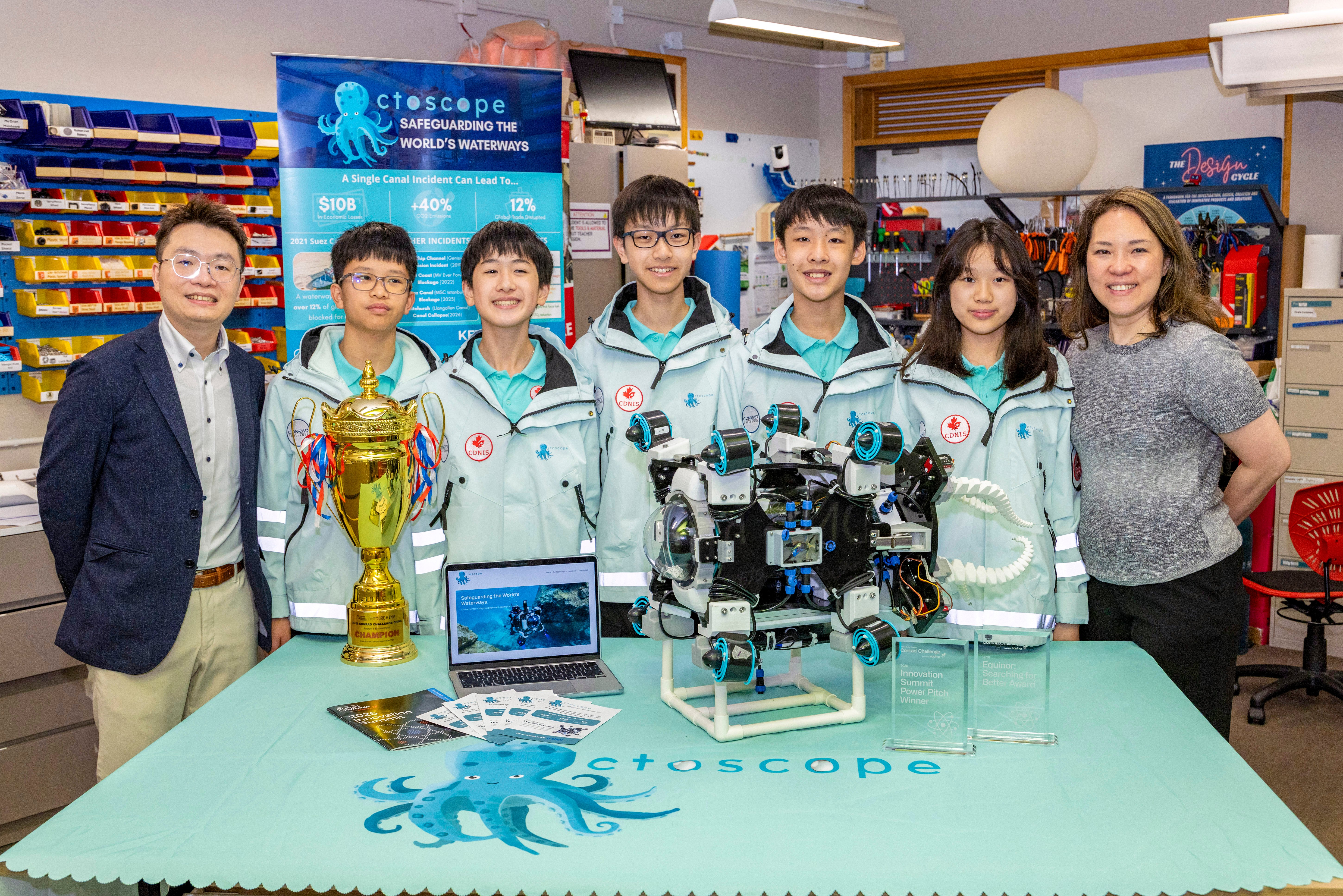 The OctoScope team with their teachers. From left: Kenneth Tang, Shou Jeng (CEO), Max (COO), Lucas (CTO), Caden (CFO), Season (CMO) and Vivian Fung with their underwater robot at Canadian International School of Hong Kong.