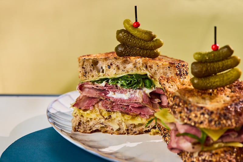 Slow-cured Mayura Wagyu pastrami is layered into toasted rye with sauerkraut and melted Swiss cheese, bringing peppery depth, gentle smoke and a rich, savoury finish to a New York deli classic.
