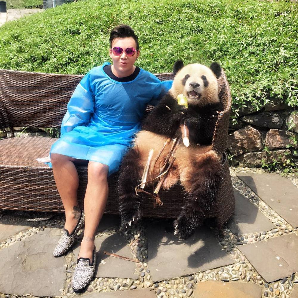 Kane Lim with a giant panda. Photo: @kanelk_k/Instagram