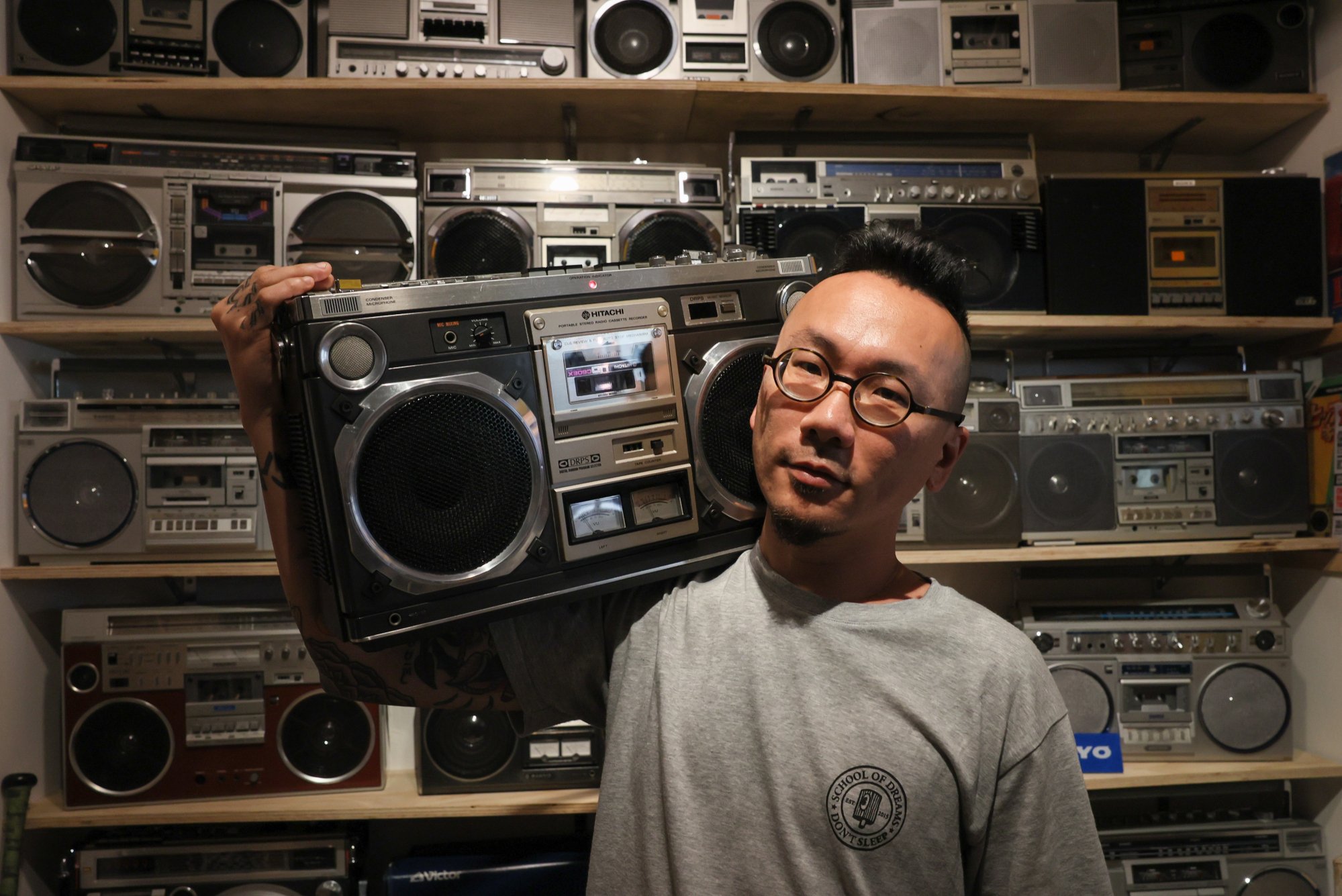 Chow Yin-chi holds a Hitachi portable stereo radio cassette player. Photo: Dickson Lee