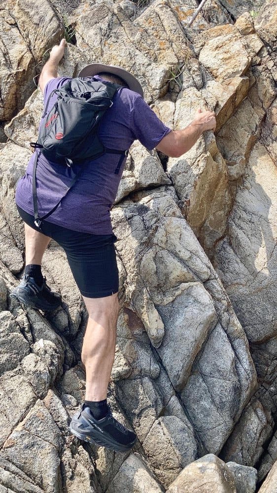 Rubinstein climbs to reach the ancient carvings on Kau Sai Chau. Photo: Marc Rubinstein