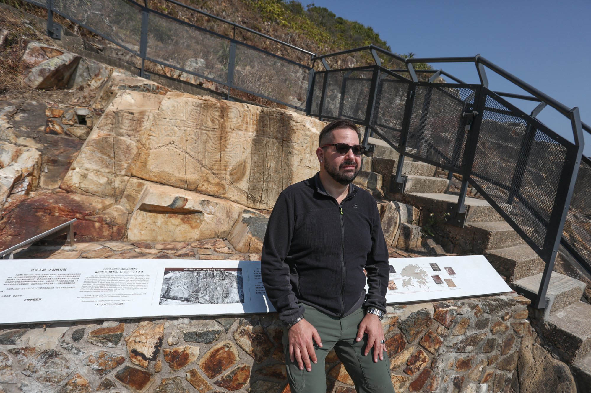 Marc Rubinstein with rock carvings in Big Wave Bay, Hong Kong Island. Photo: Jonathan Wong
