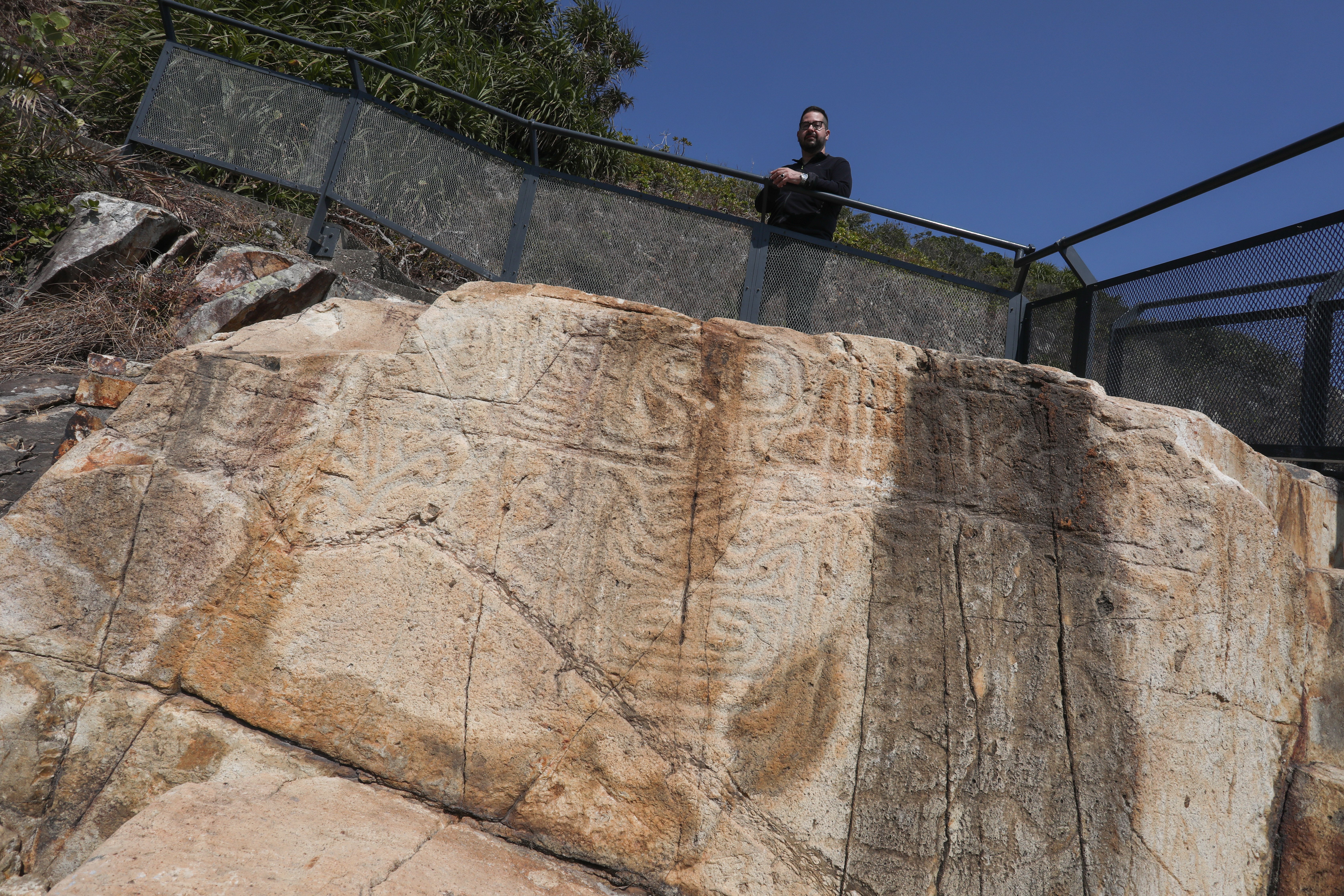 Marc Rubinstein with rock carvings in Big Wave Bay, Hong Kong Island, on February 03, 2021.  Rubinstein has spent 2020 searching for ancient rock carvings in Hong Kong and discovered this city’s rich history stretches way before it was ceded to Britain in 1842. 03FEB21 [FEATURES]  SCMP / Jonathan Wong