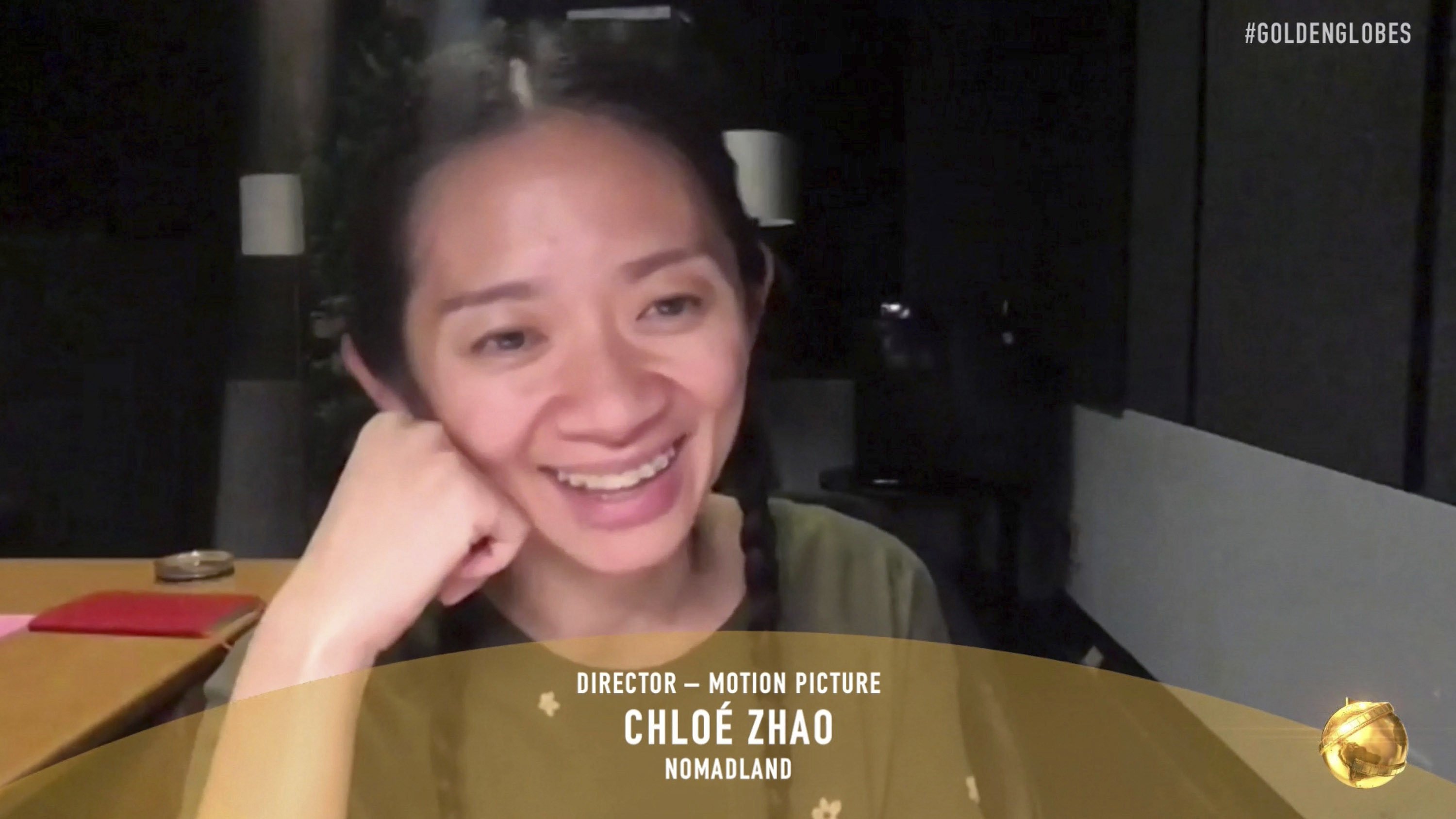 Chloé Zhao accepts the award for best director for a motion picture for Nomadland at the Golden Globe Awards. NBC via AP