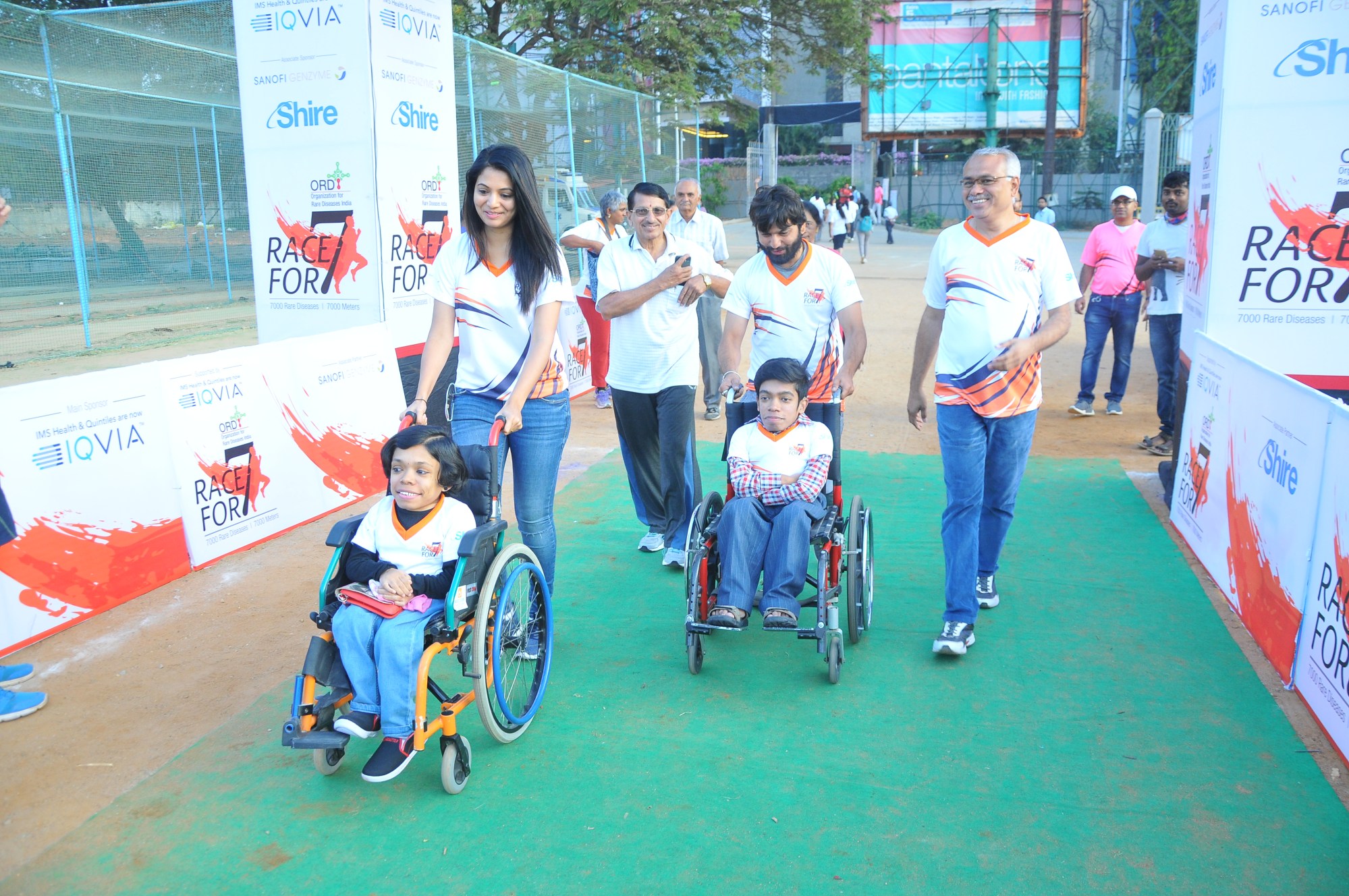 Shirol (right) and participants at a Race For 7 event to raise awareness of rare diseases. The twins in wheelchairs are living with MPS IV, a progressive condition that mainly affects the skeleton. Photo: Courtesy of the Shirol family