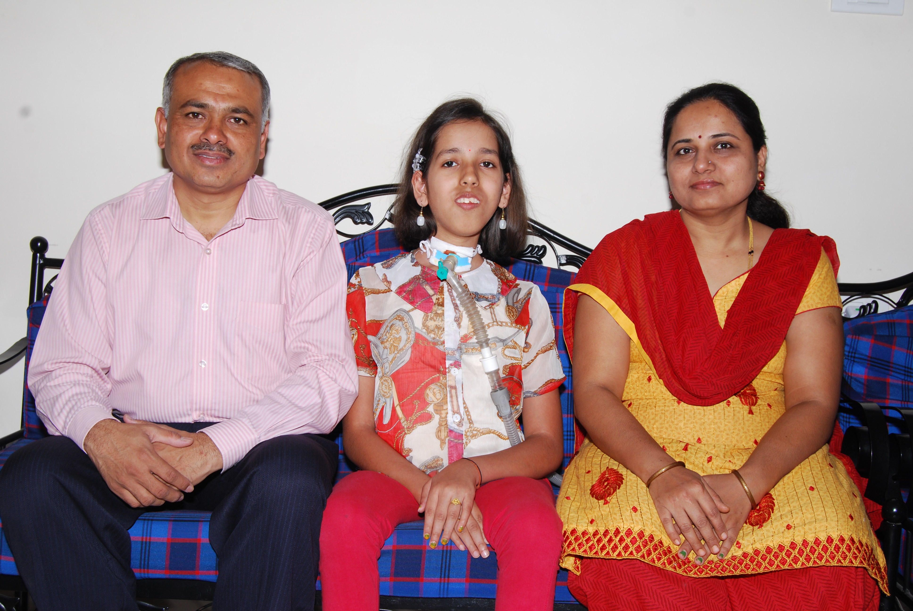 Prassana Shirol (left), his wife Sharadha and their daughter Nidhi (centre). His daughter’s hours-long treatments for a rare, lifelong disease led to Shirol setting up rare disease centres in public and private hospitals in India. Photo: courtesy of the Shirol family