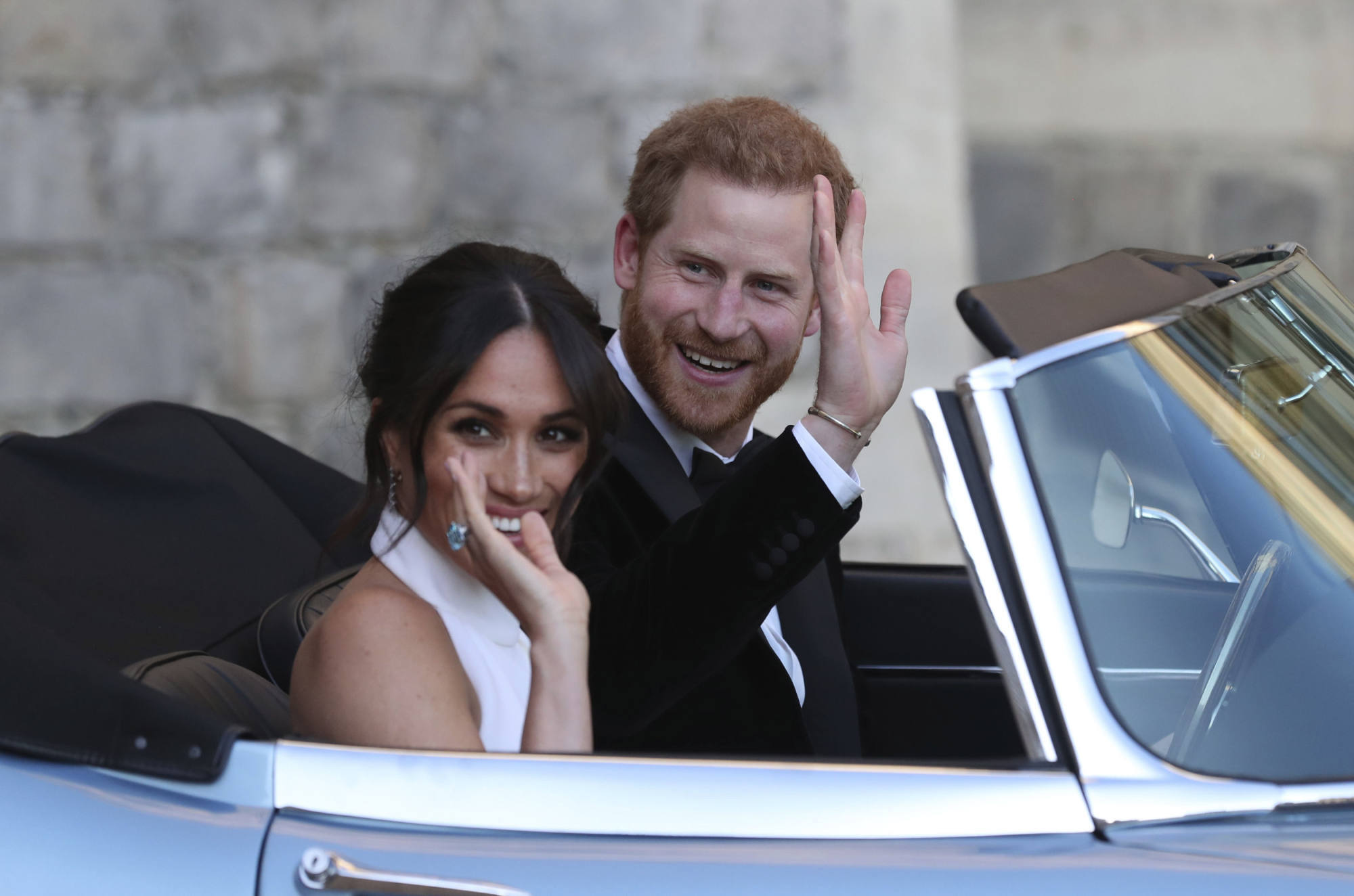 Meghan Markle and Prince Harry after their wedding in Windsor. Meghan Markle wears an aquamarine ring once belonging to Princess Diana. Photo: AP