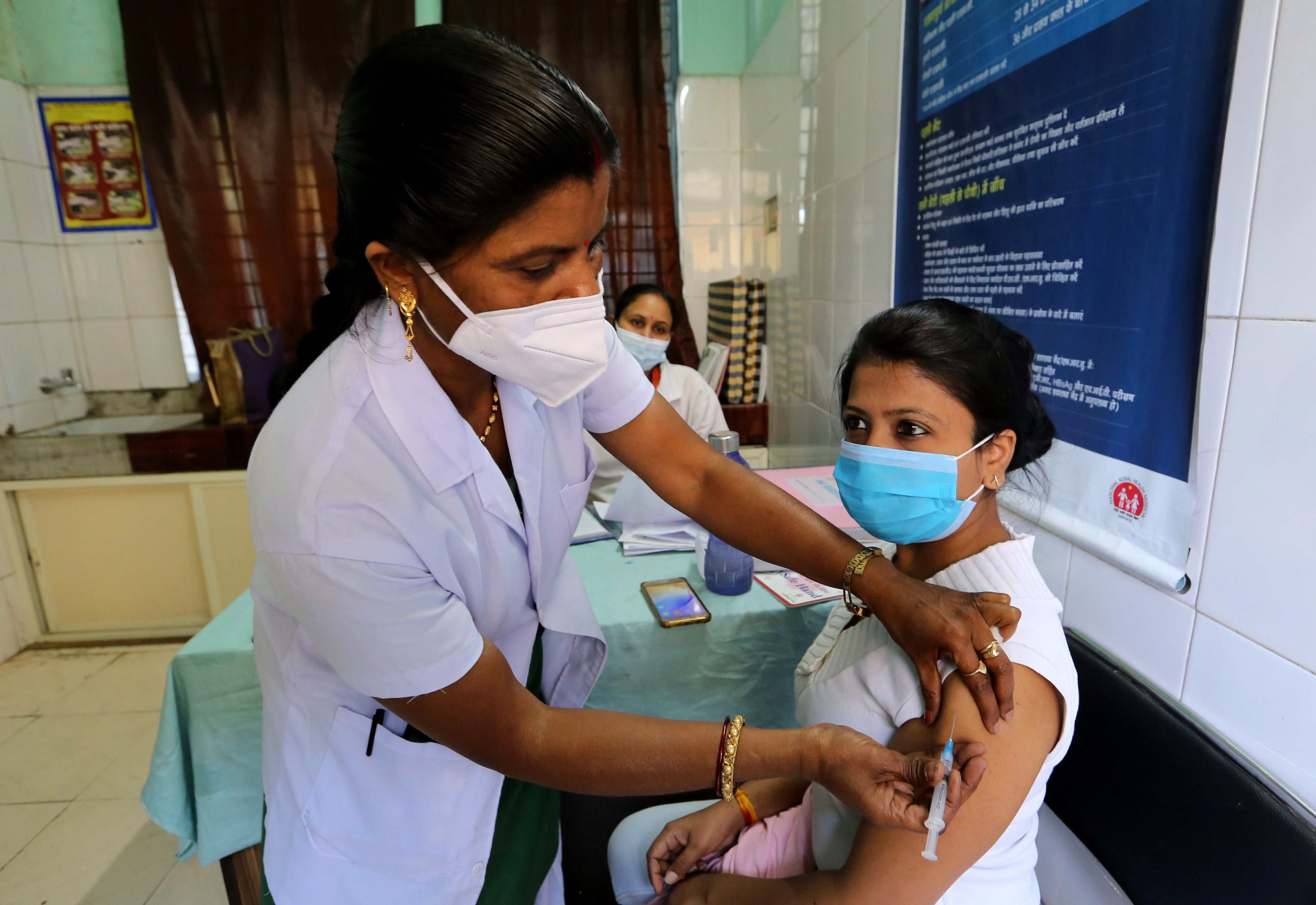 A woman receives a shot of a Covid-19 vaccine in Bhopal, India, on March 6. India, South Africa and other countries have proposed that the WTO exempt member countries from enforcing some patents and other intellectual property rights for a limited period to help countries contain Covid-19. Photo: EPA-EFE