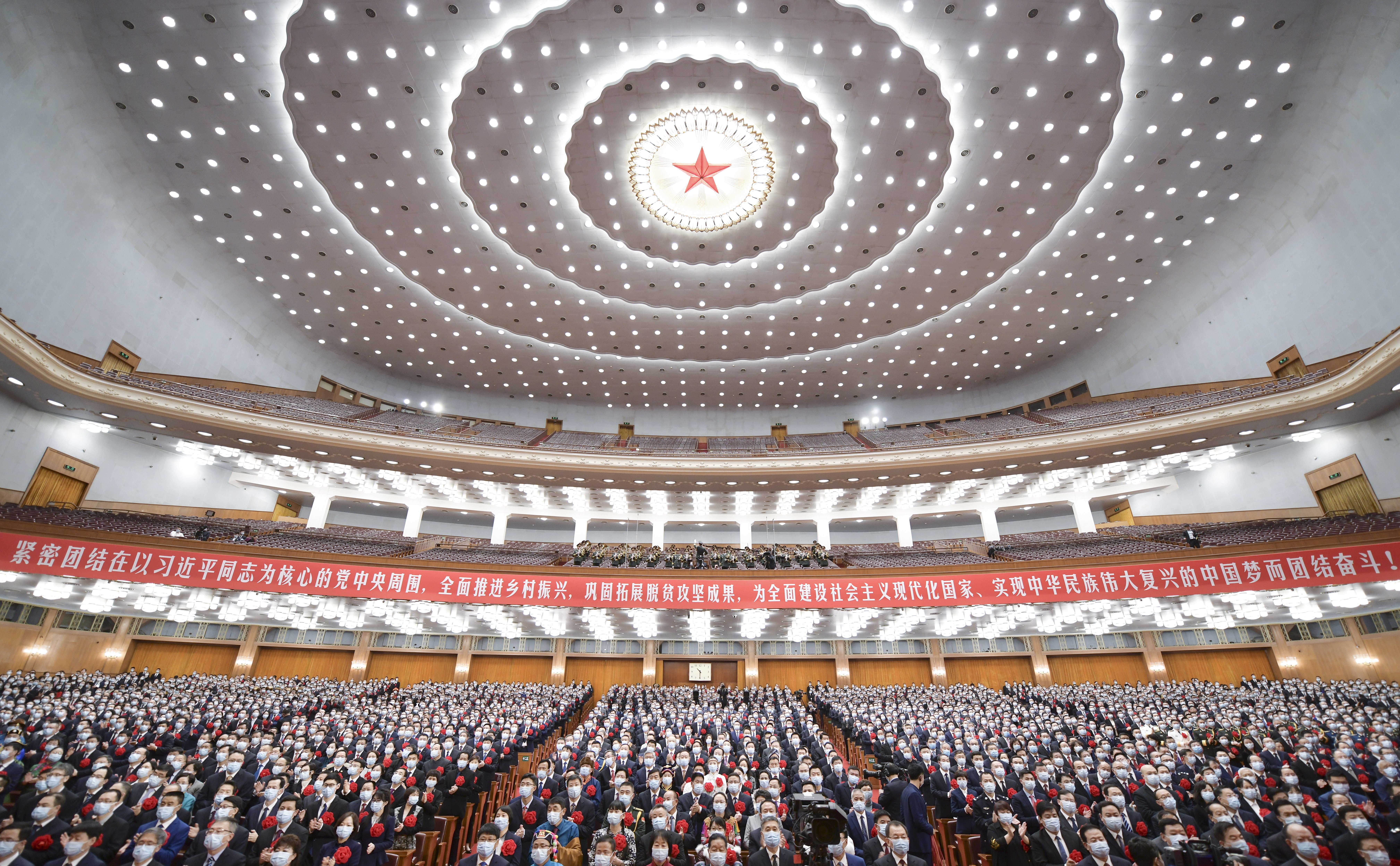 China marks its accomplishments in poverty alleviation and honours its poverty fighters at the Great Hall of the People in Beijing, on February 25. Photo: Xinhua