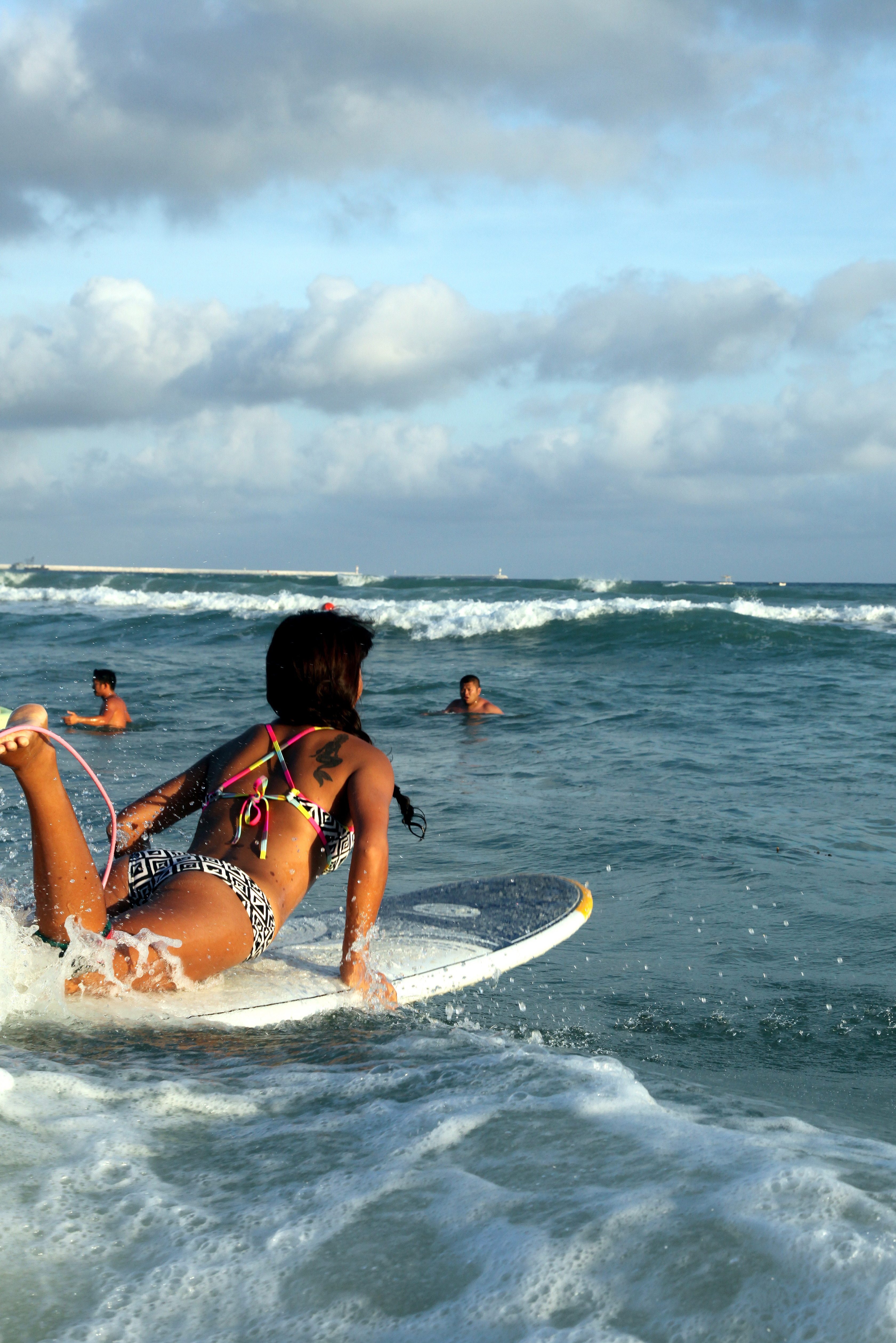 A Chinese woman surfs at Dadonghai beach in Hainan. The southern Chinese holiday island is seeing a surfing boom, and most of the clients of surf schools are young women. Photo:  Olivier Chouchana/Gamma-Rapho via Getty Images