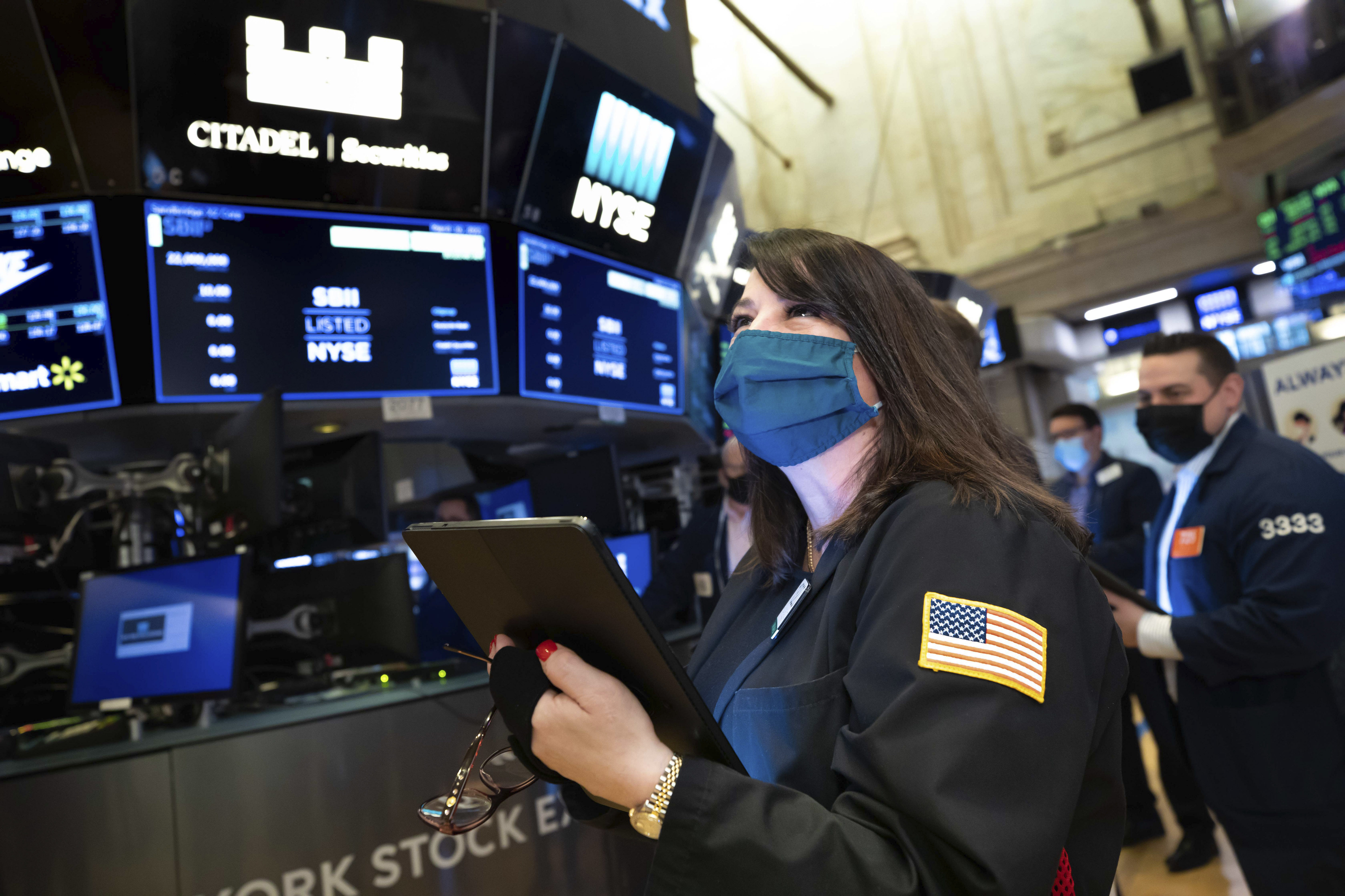 A trader works on the floor of the New York Stock Exchange on March 10 when stability in the bond market translated into gains for stocks. Photo: AP