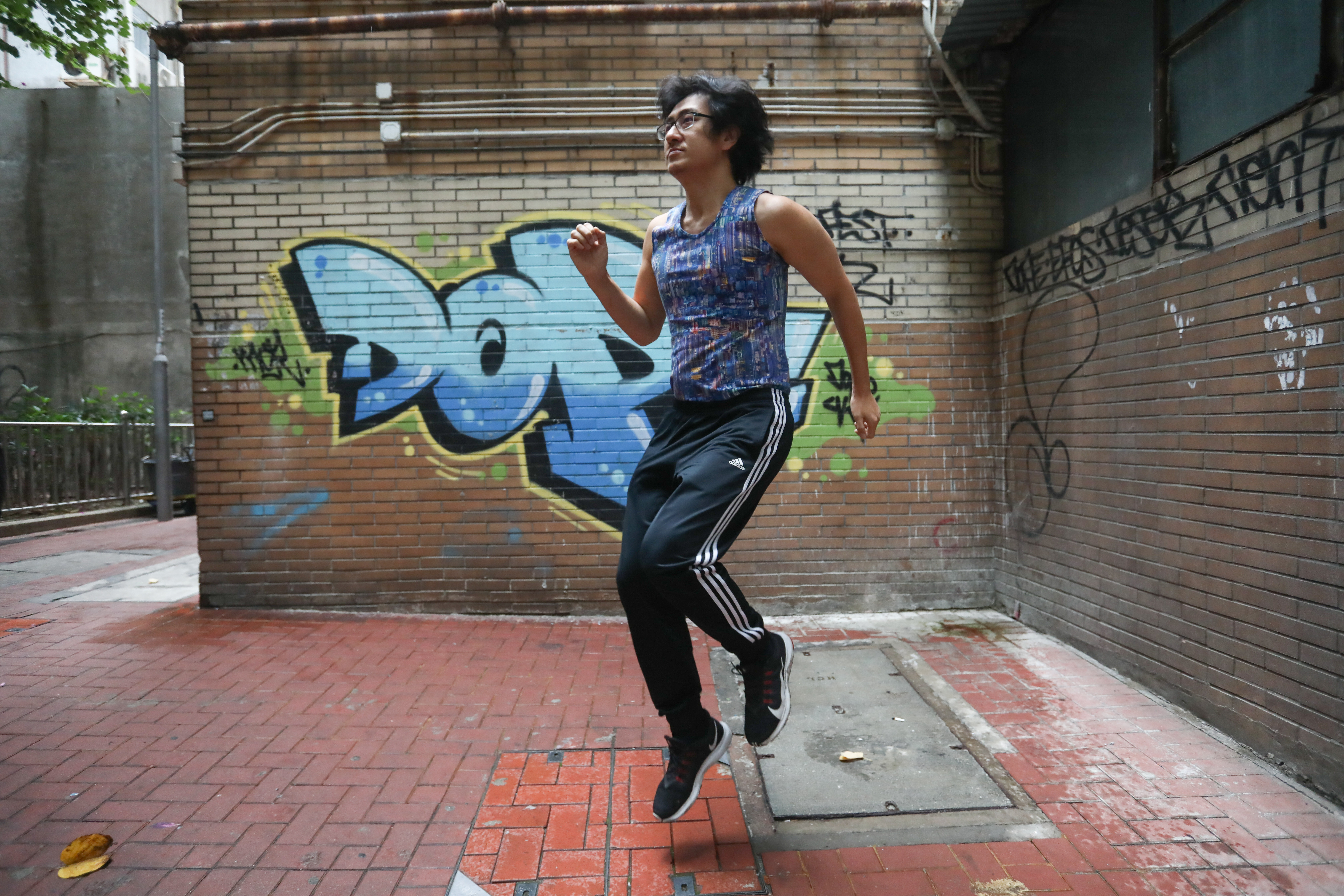 Formerly overweight, Keon Lee goes through his exercise routine, in Sheung Wan, Hong Kong. Photo: Jonathan Wong