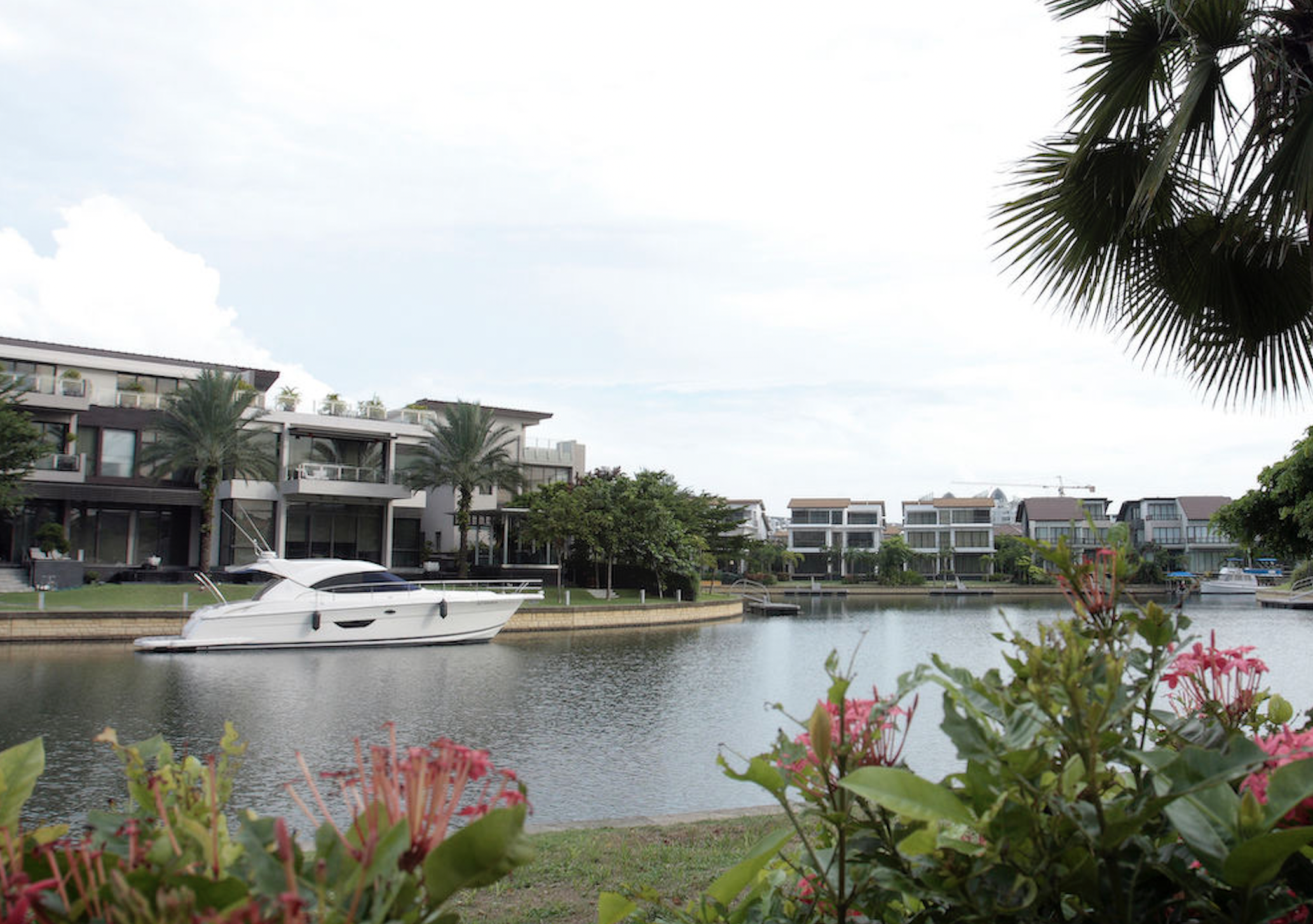 Bungalows with private berths along the waterway are typical of the sorts of property available in Sentosa Cove, Singapore, often at lower prices than comparable property on the mainland. Photo: EdgeProp Singapore