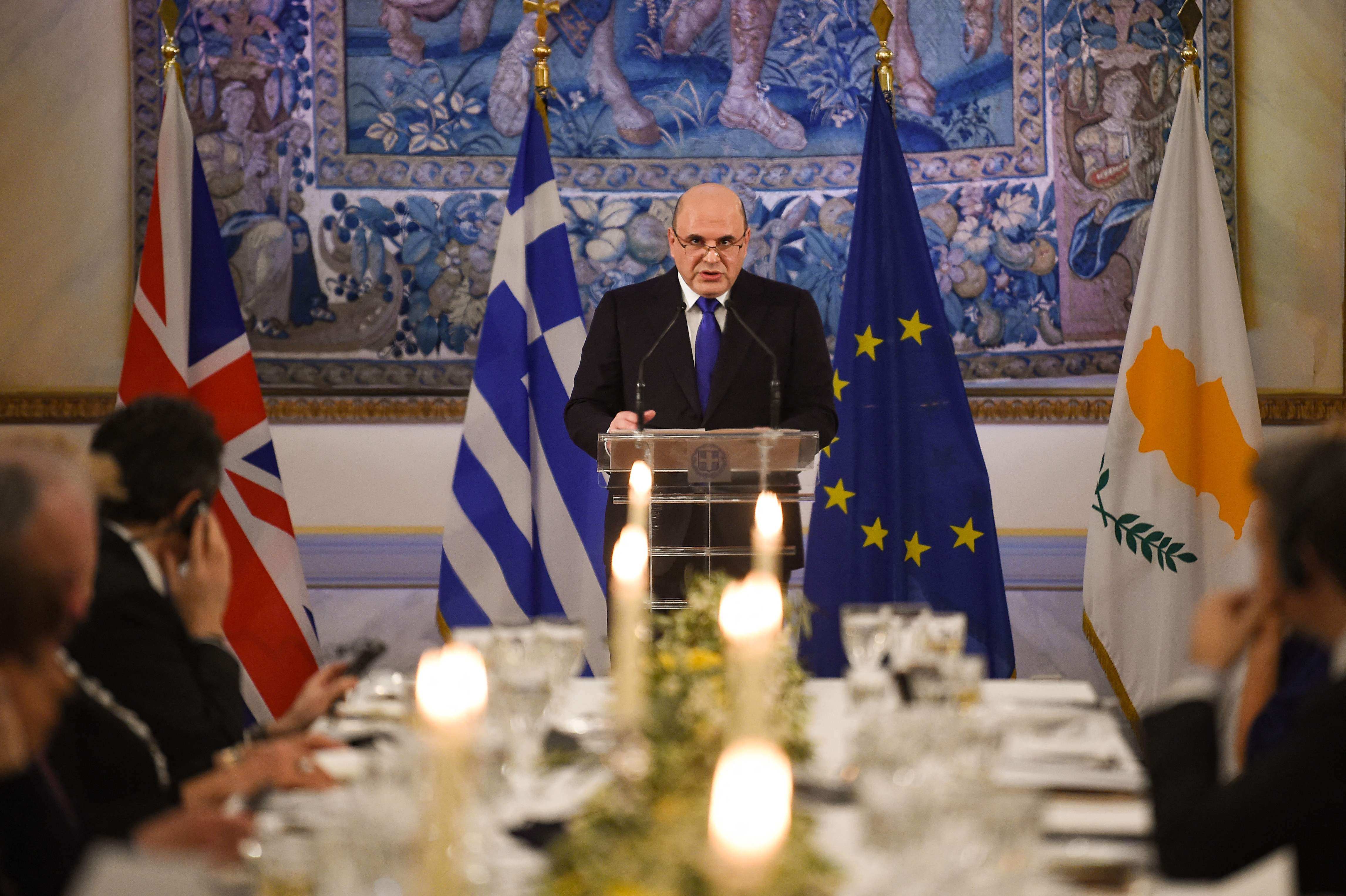 Russian Prime Minister Mikhail Mishustin delivers a speech during an official dinner with the Greek President at the presidential mansion in Athens on March 24, 2021, as Greece celebrates 200th anniversary of 1821 revolution and war of independence. (Photo by ANGELOS TZORTZINIS / POOL / AFP)