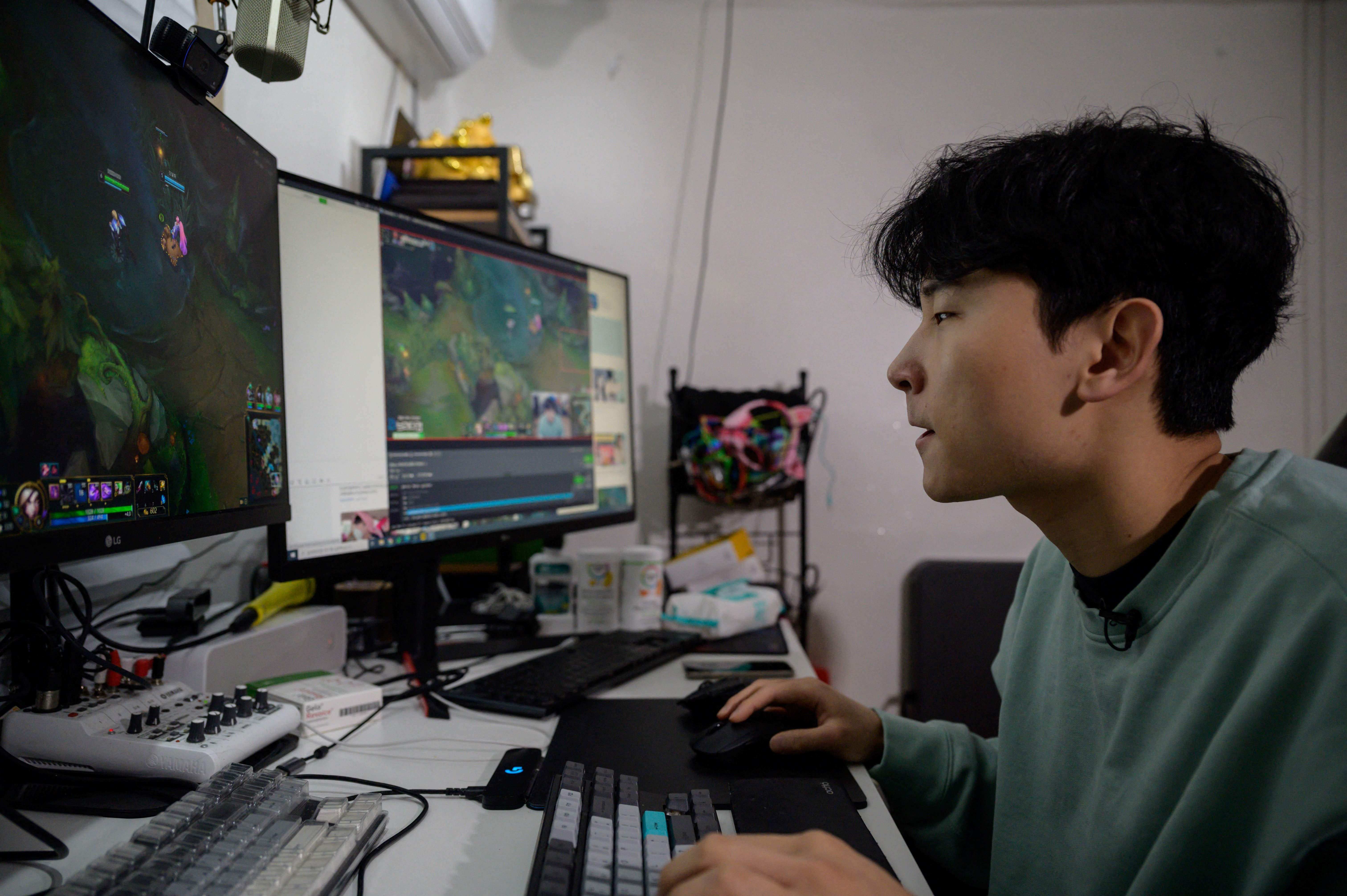 South Korean gamer Kim Min-kyo streaming computer games at his home near Anyang south of Seoul. Photo: AFP