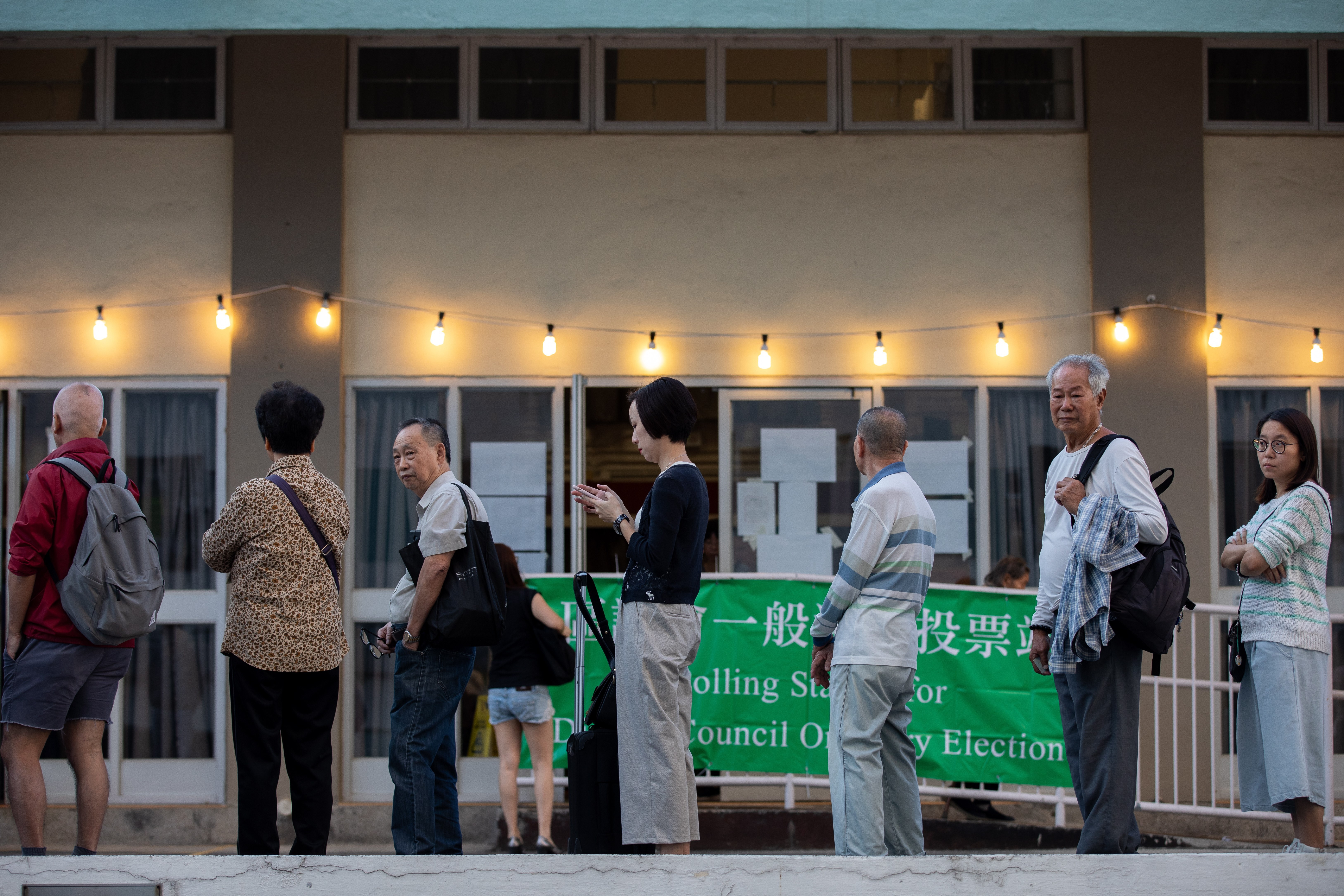 Residents queue up to cast their votes in the 2019 district council elections. Photo: EPA-EFE