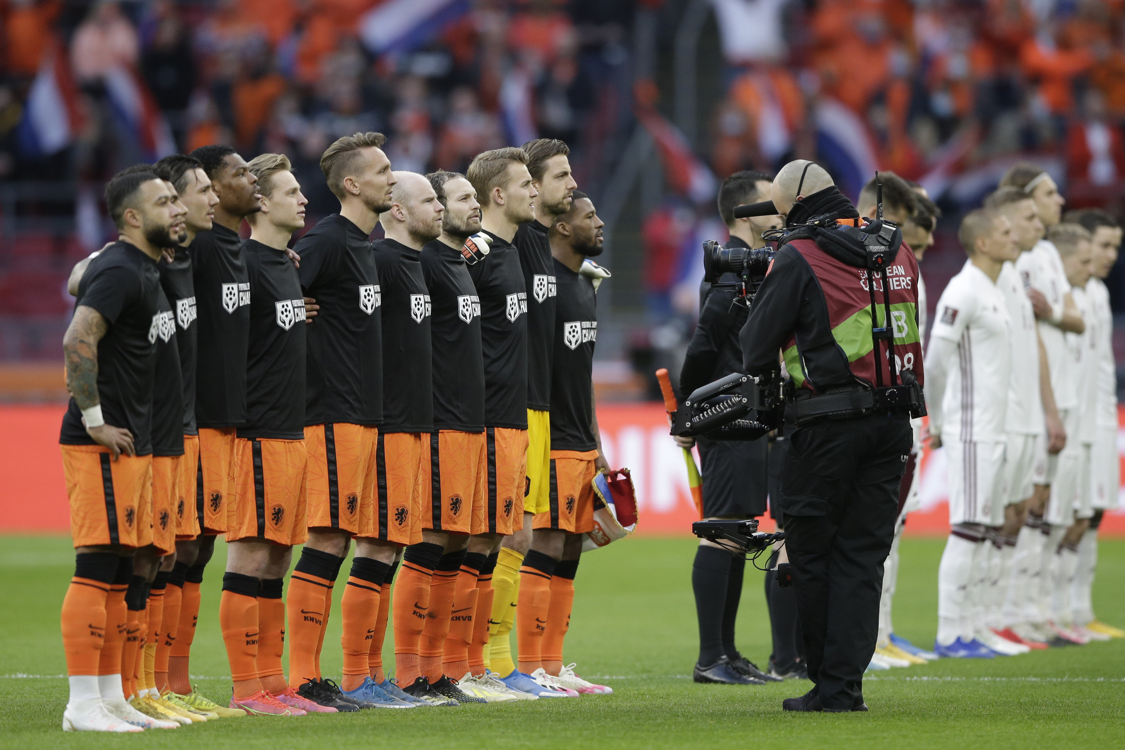 Netherlands football players wear shirts reading ‘Football Supports Change’ prior to the start of the World Cup 2022 group G qualifying match between The Netherlands and Latvia in Amsterdam on Saturday. Photo: AP 
