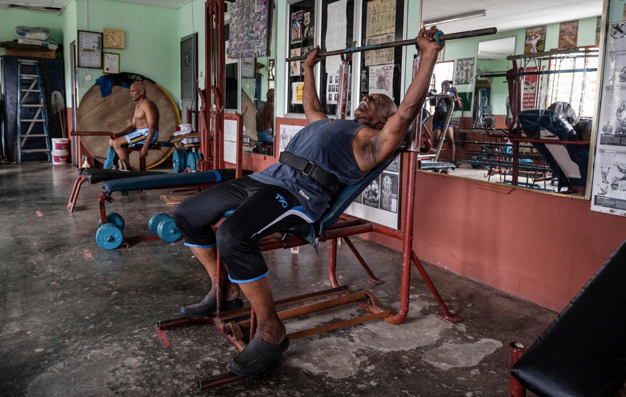 Arokiasamy does some warm-up exercises at his gym in Teluk Intan. Photo: AFP