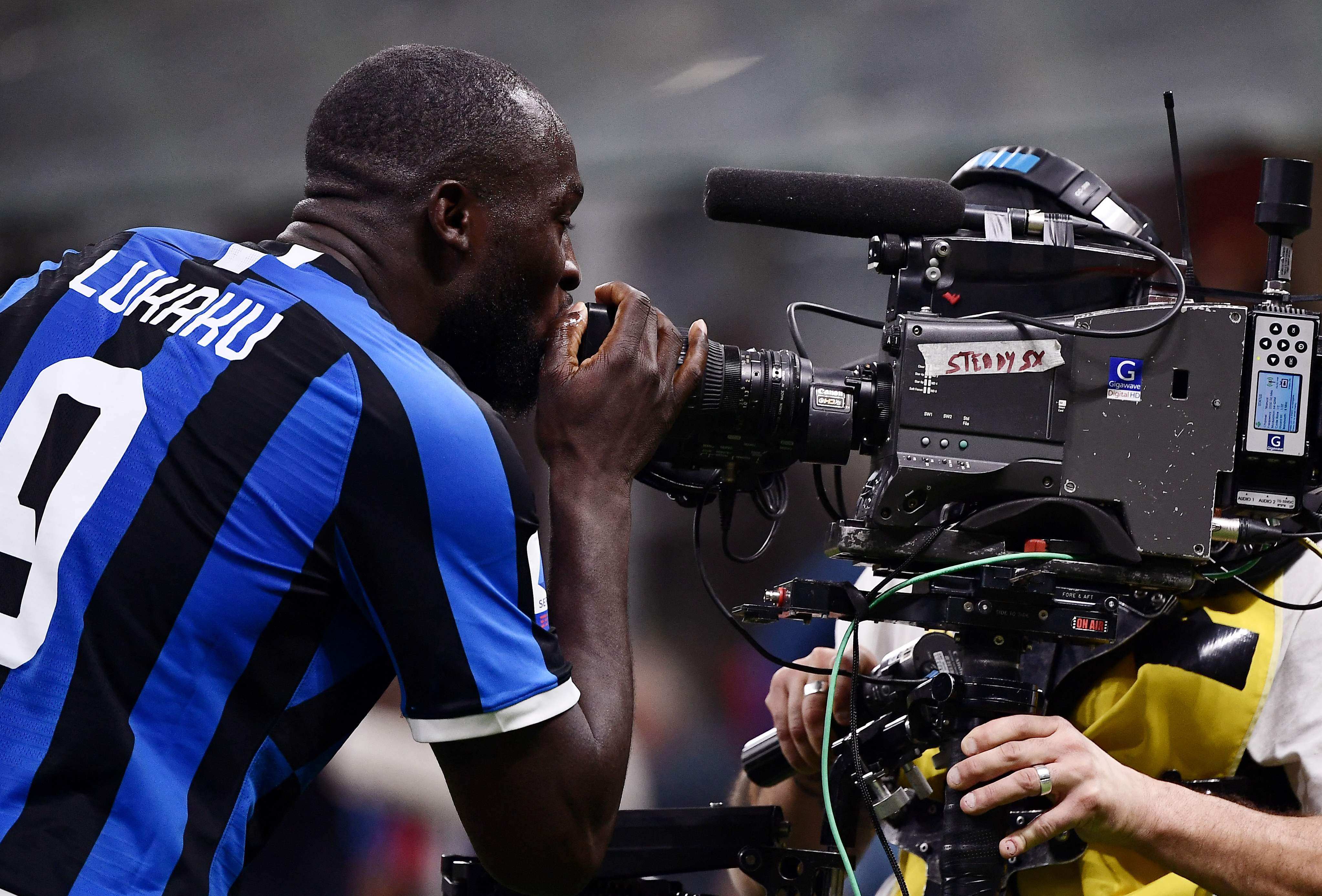 Inter Milan’s Belgian forward Romelu Lukaku kisses a television broadcast camera after scoring against AC Milan in 2019. Photo:AFP