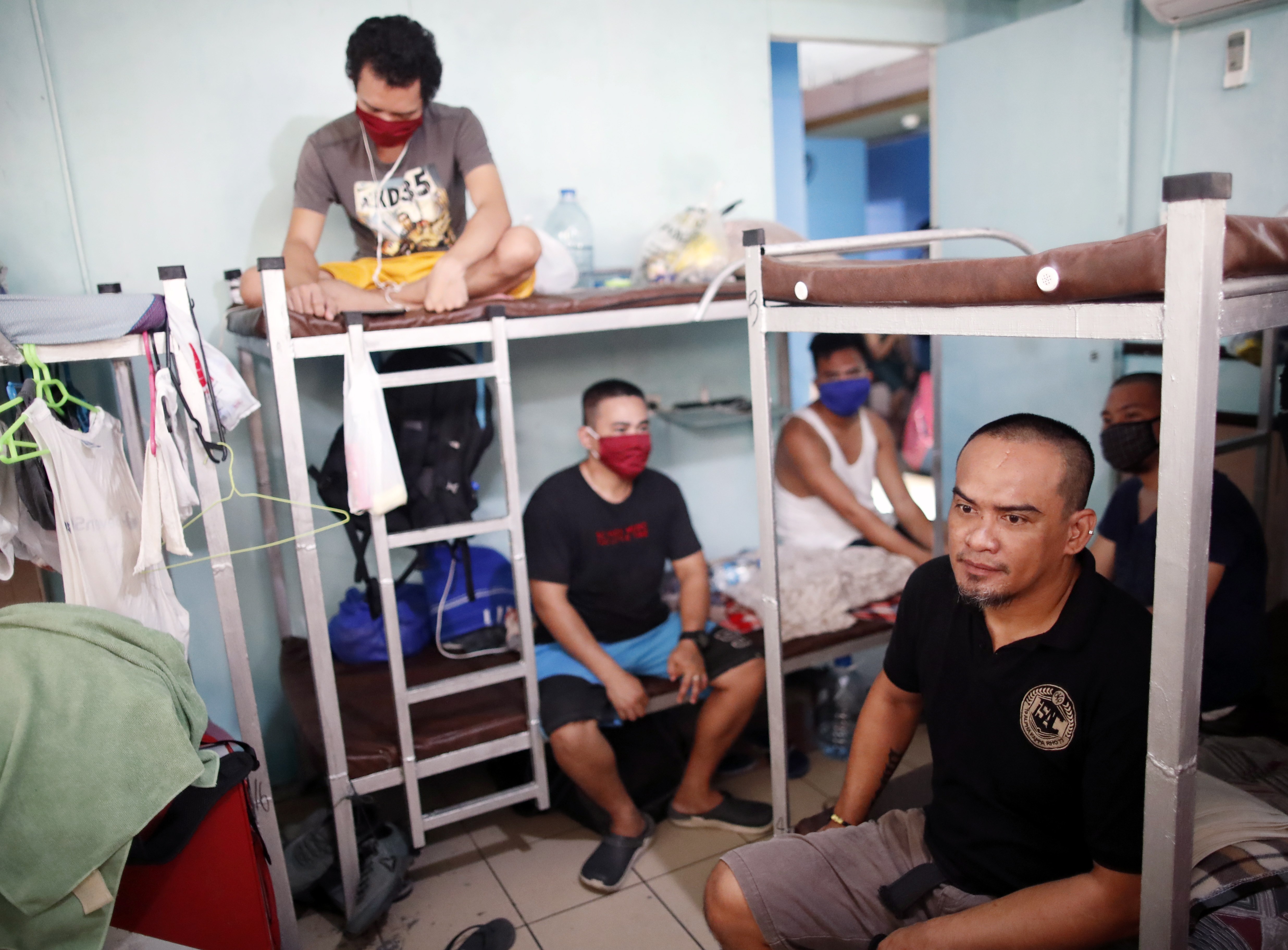 Filipino seafarers stranded amid the coronavirus pandemic rest inside a dormitory in Manila, Philippines, on April 29, 2020. Photo: EPA-EFE