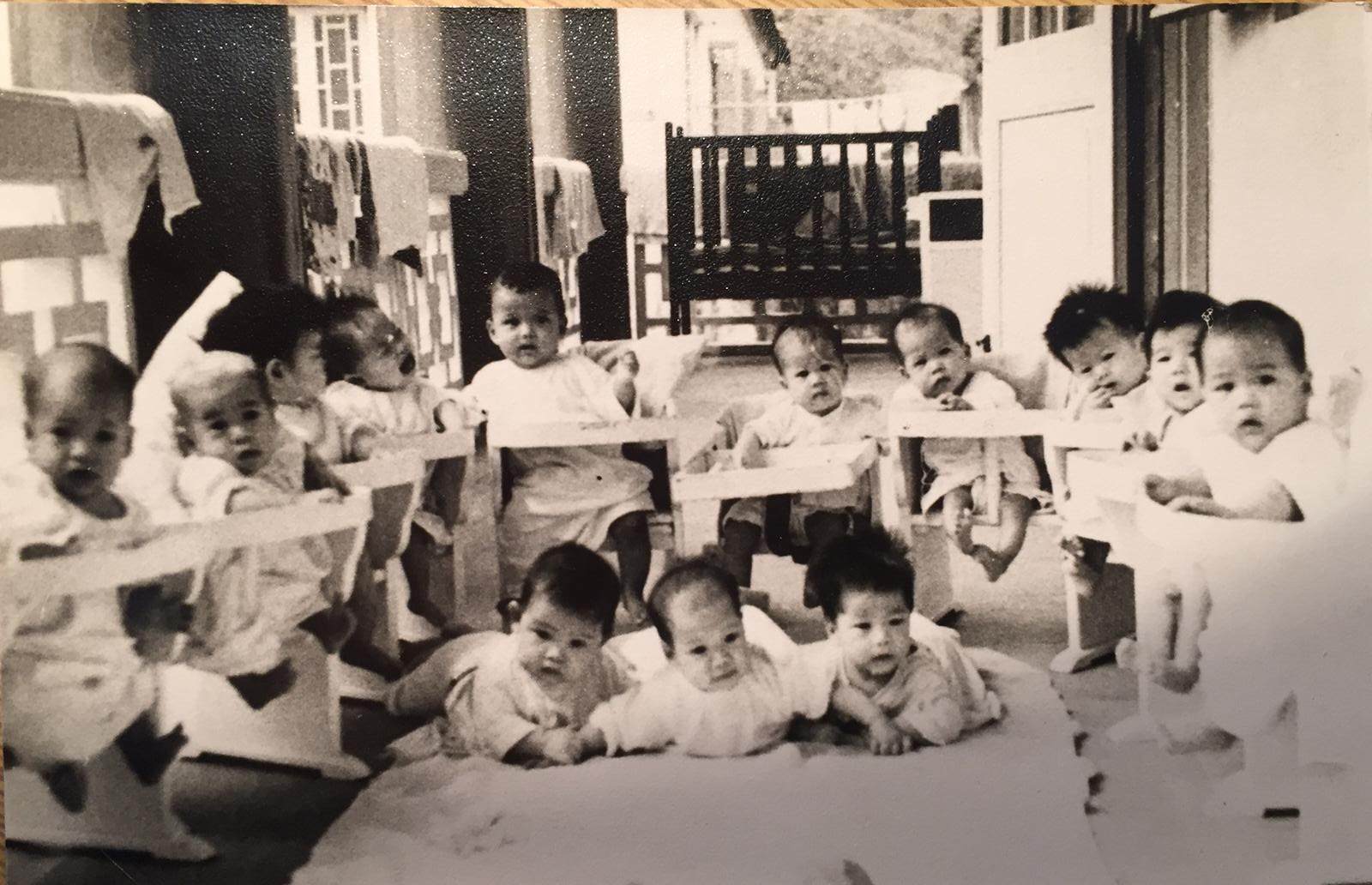 Infants at the Po Leung Kuk children’s home in October 1961, including one believed to be Martin (crying, fourth from left). Photo: Claire Martin / Red Door News