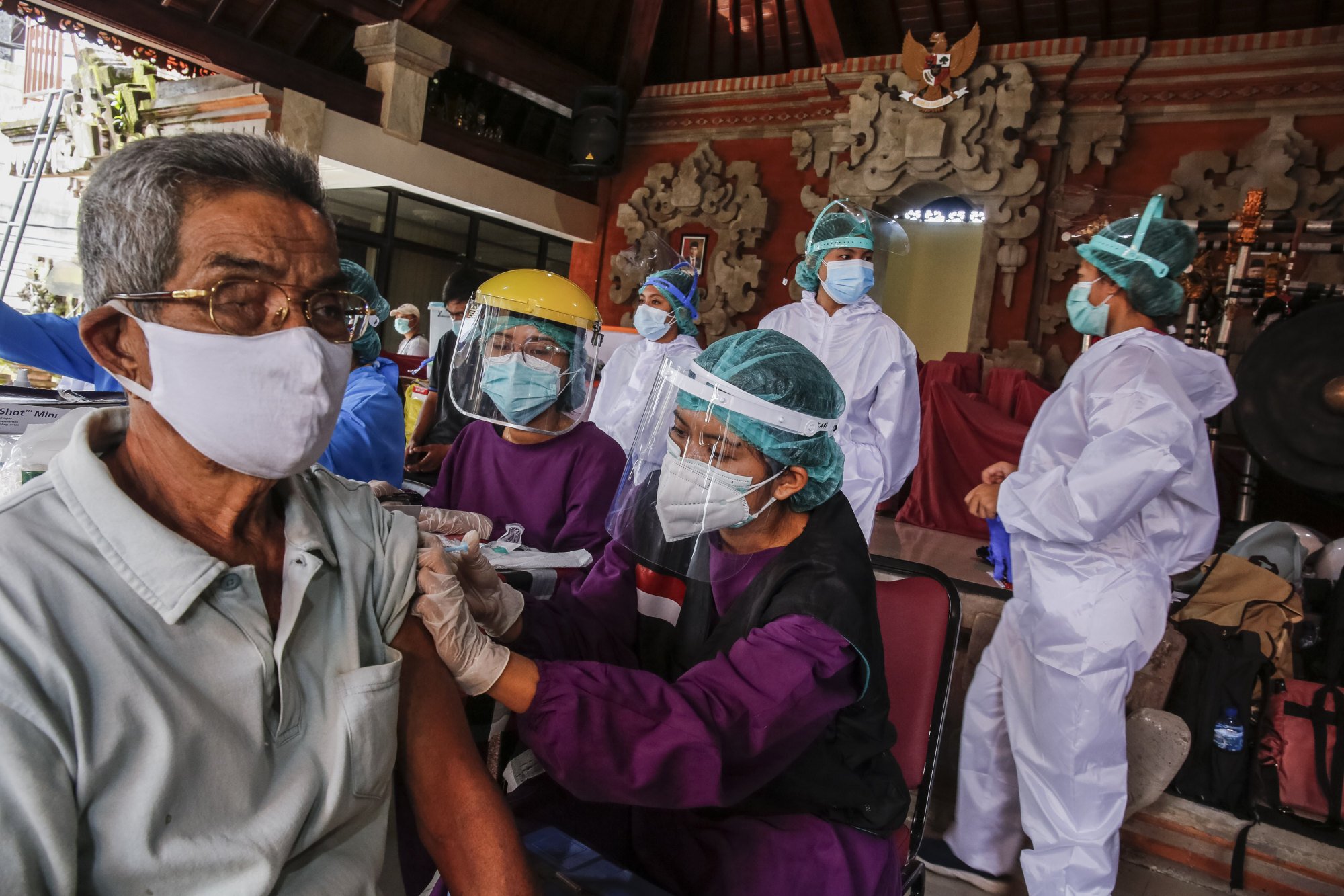 A health worker is vaccinated against Covid-19 in Denpasar, on March 22. Photo: Getty Images