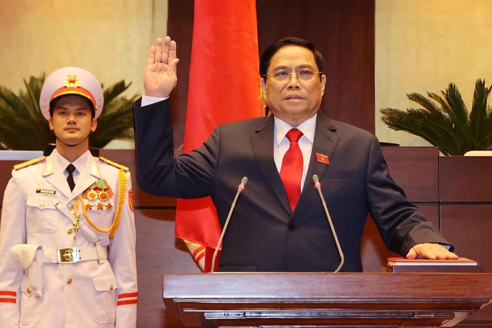 Pham Minh Chinh takes the oath of office after being elected as the prime minister in Hanoi, Vietnam, on Monday. Photo: EPA/Vietnam News Agency Handout