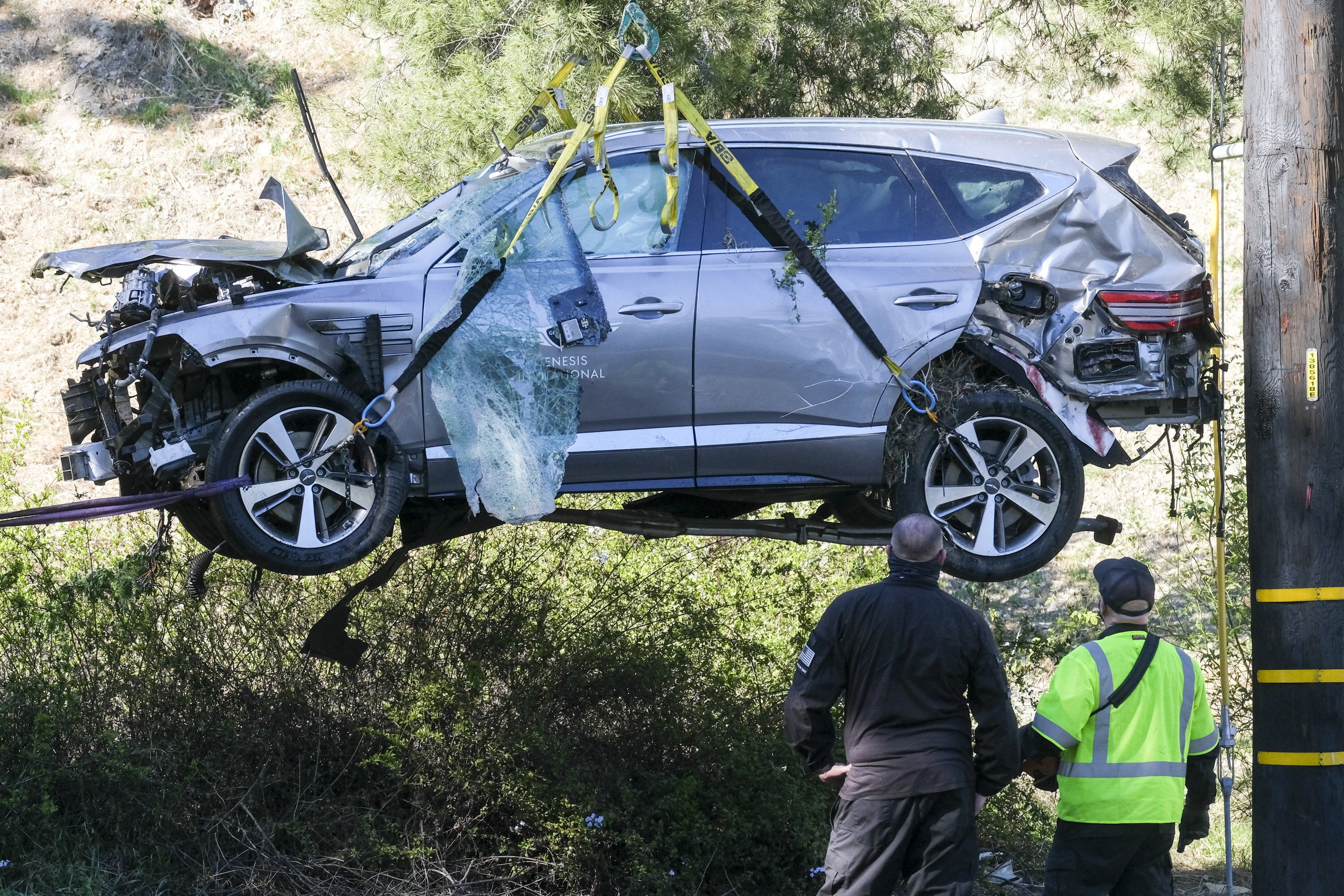 A crane is used to lift a vehicle following a rollover accident involving golfer Tiger Woods in the Los Angeles area in February. Photo: AP