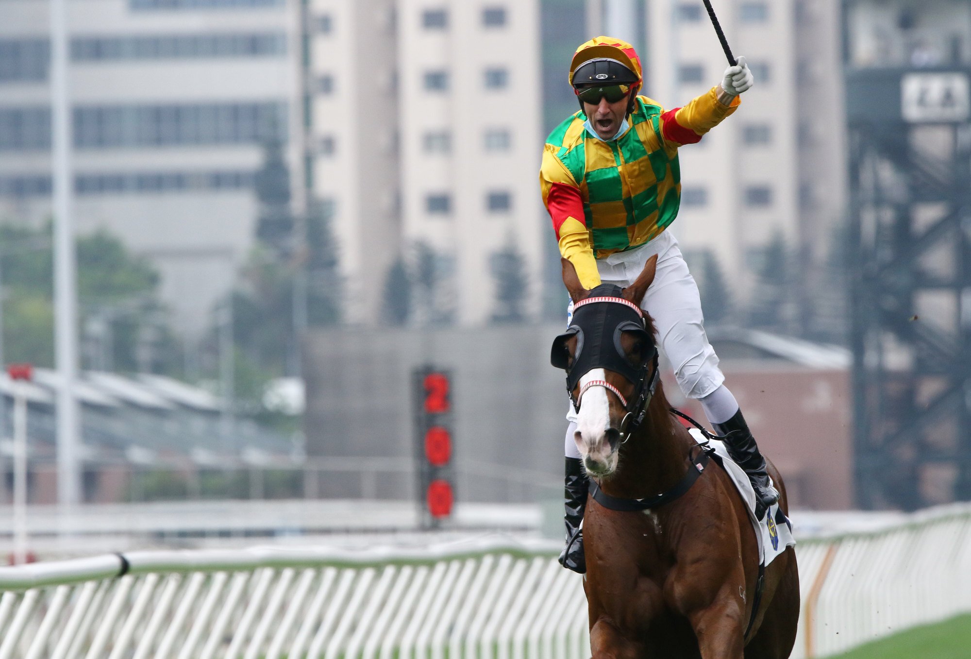 Neil Callan salutes as Mighty Giant wins the Chairman’s Trophy on Monday.