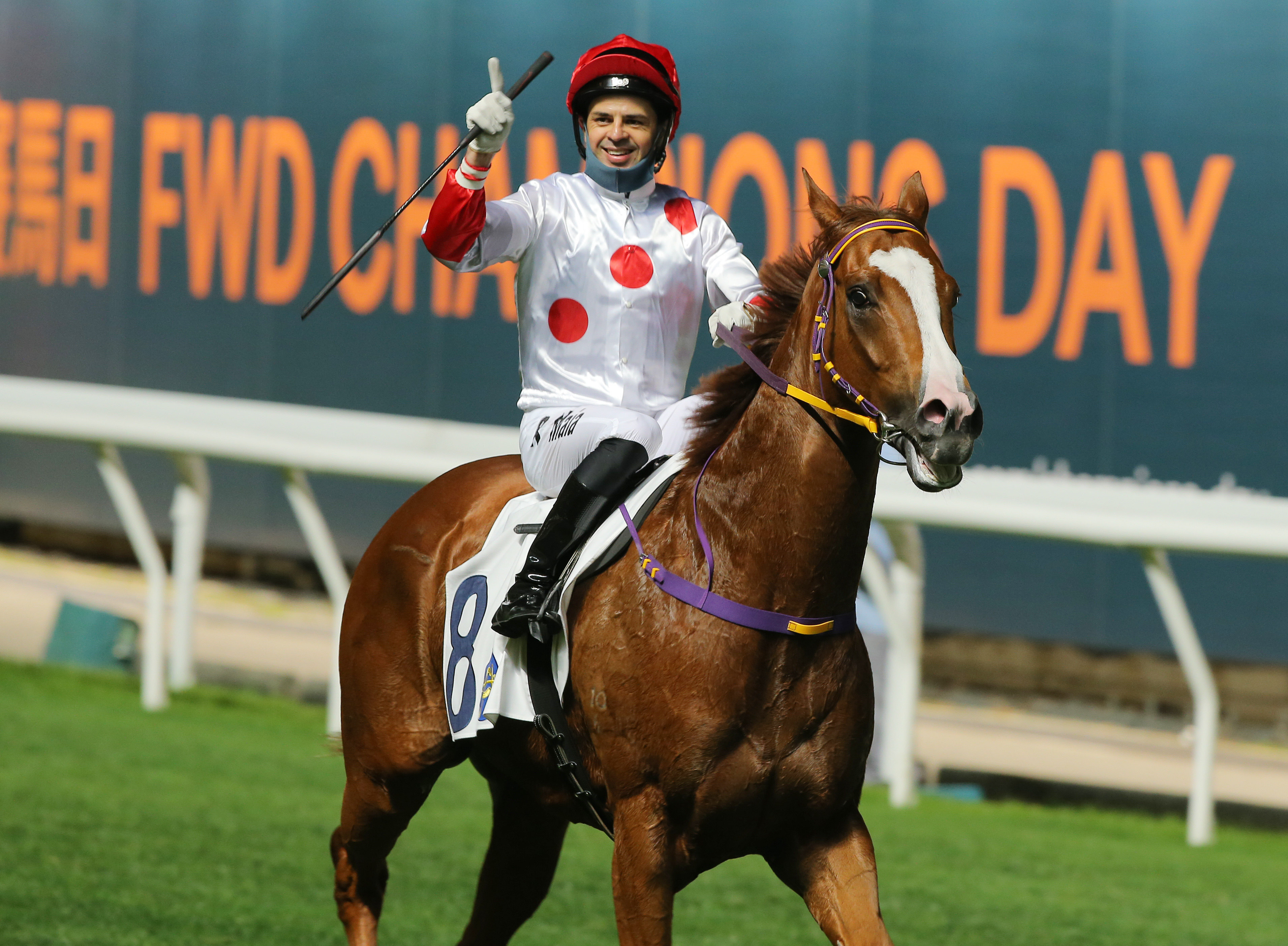 Ruan Maia celebrates his win aboard Wine And Wine at Happy Valley on Thursday night. Photos: Kenneth Chan