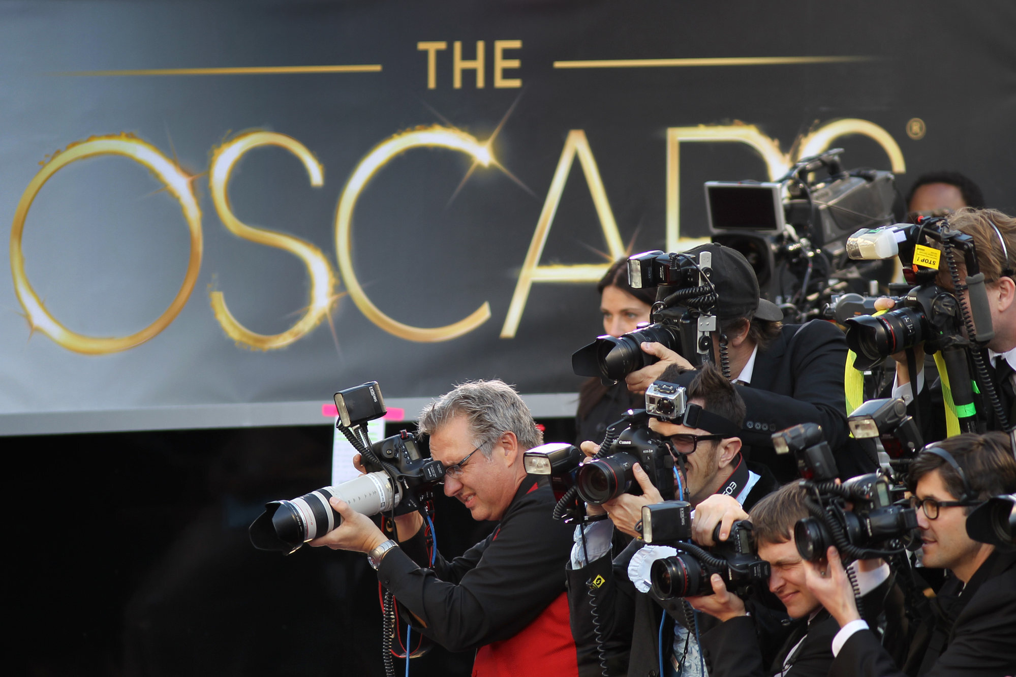 Photographers cover the red carpet arrivals for the 85th Annual Academy Awards in Hollywood, California. Photo: Getty Images