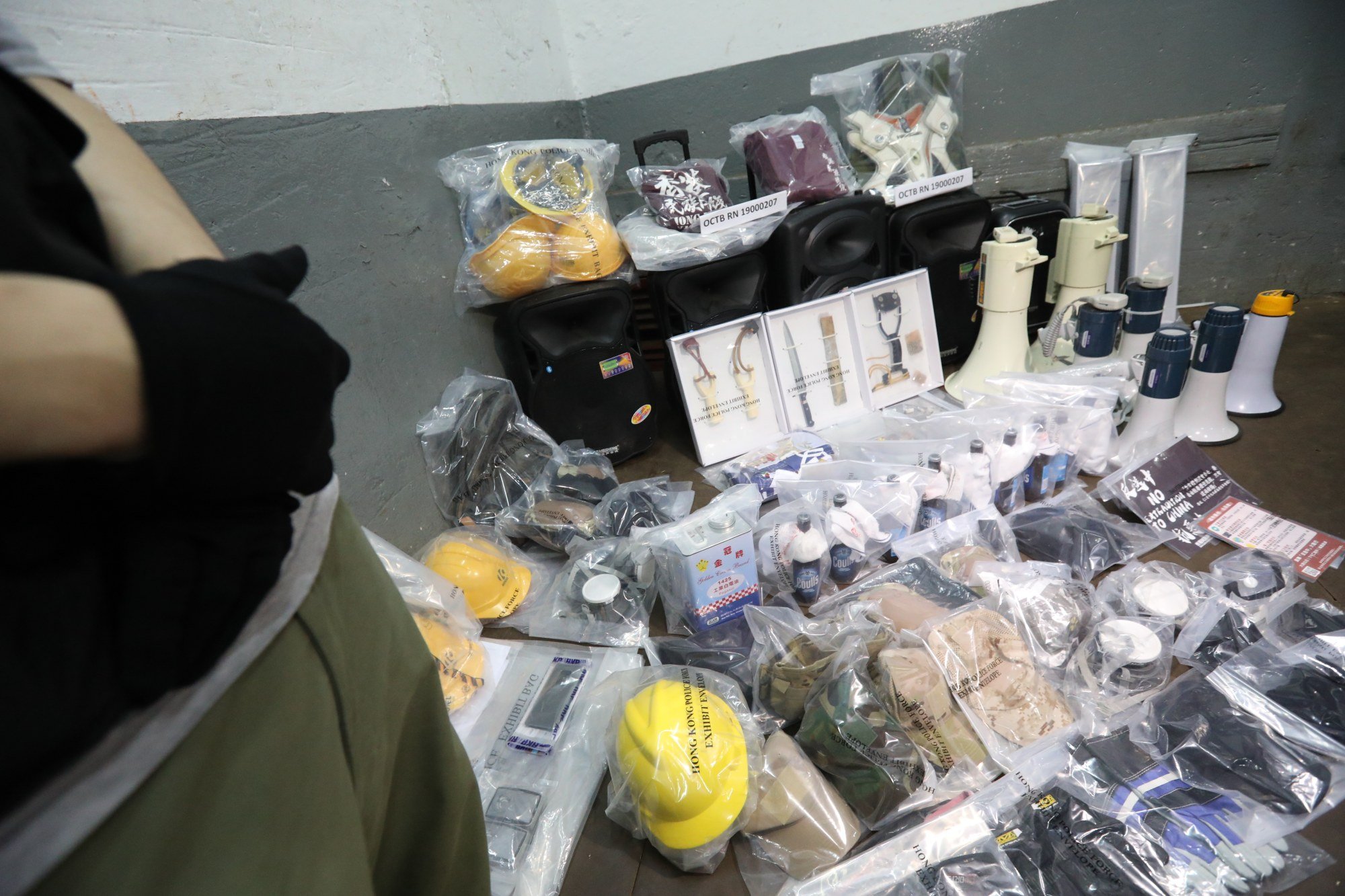 Police display a cache of explosives, protest gear and pro-independence materials seized during a raid of the premises rented by defendant Louis Lo. Photo: Felix Wong Police display a cache of explosives, protest gear and pro-independence materials seized during a raid of the premises rented by defendant Louis Lo. Photo: Felix Wong