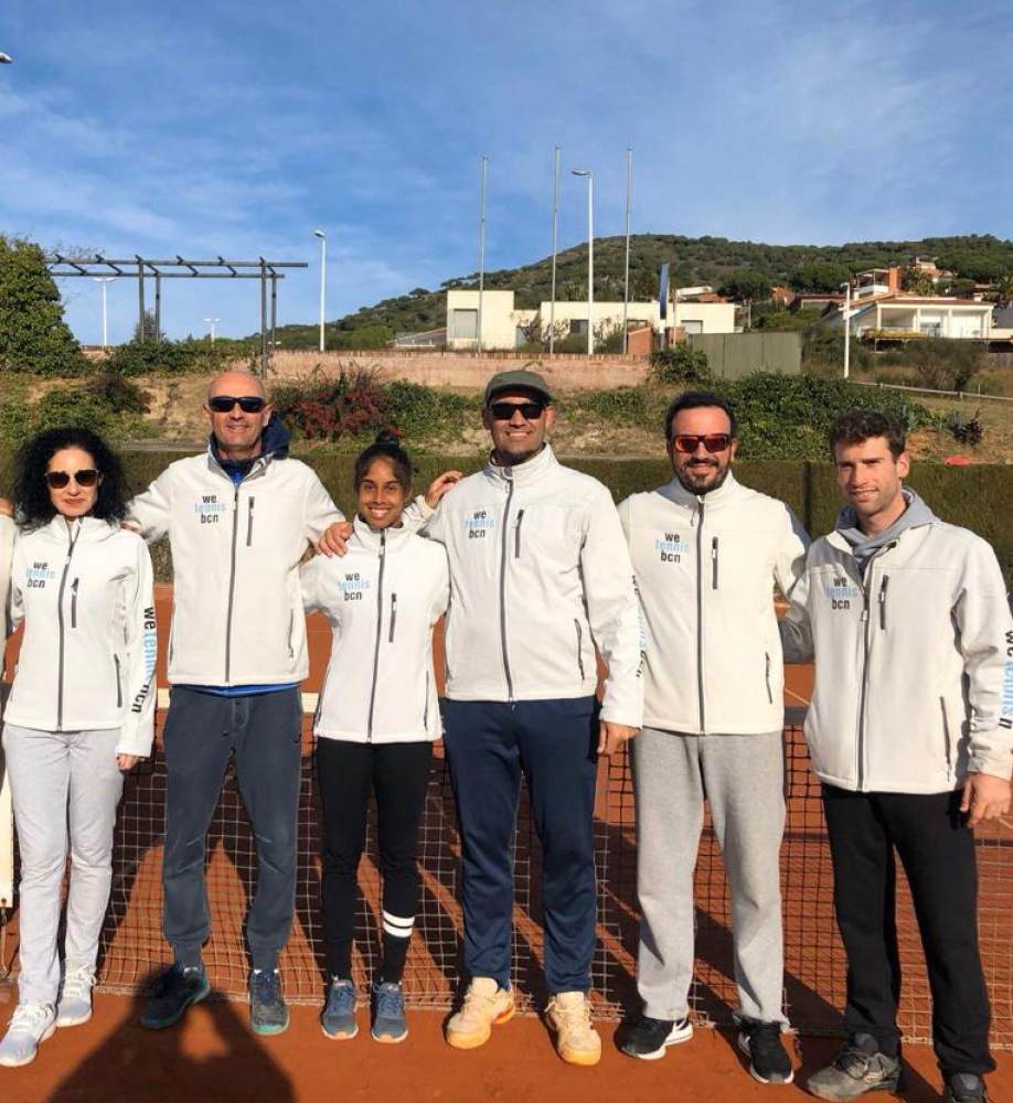 Adithya Karunaratne (third from left) with her Barcelona academy coaches. Photo: Handout