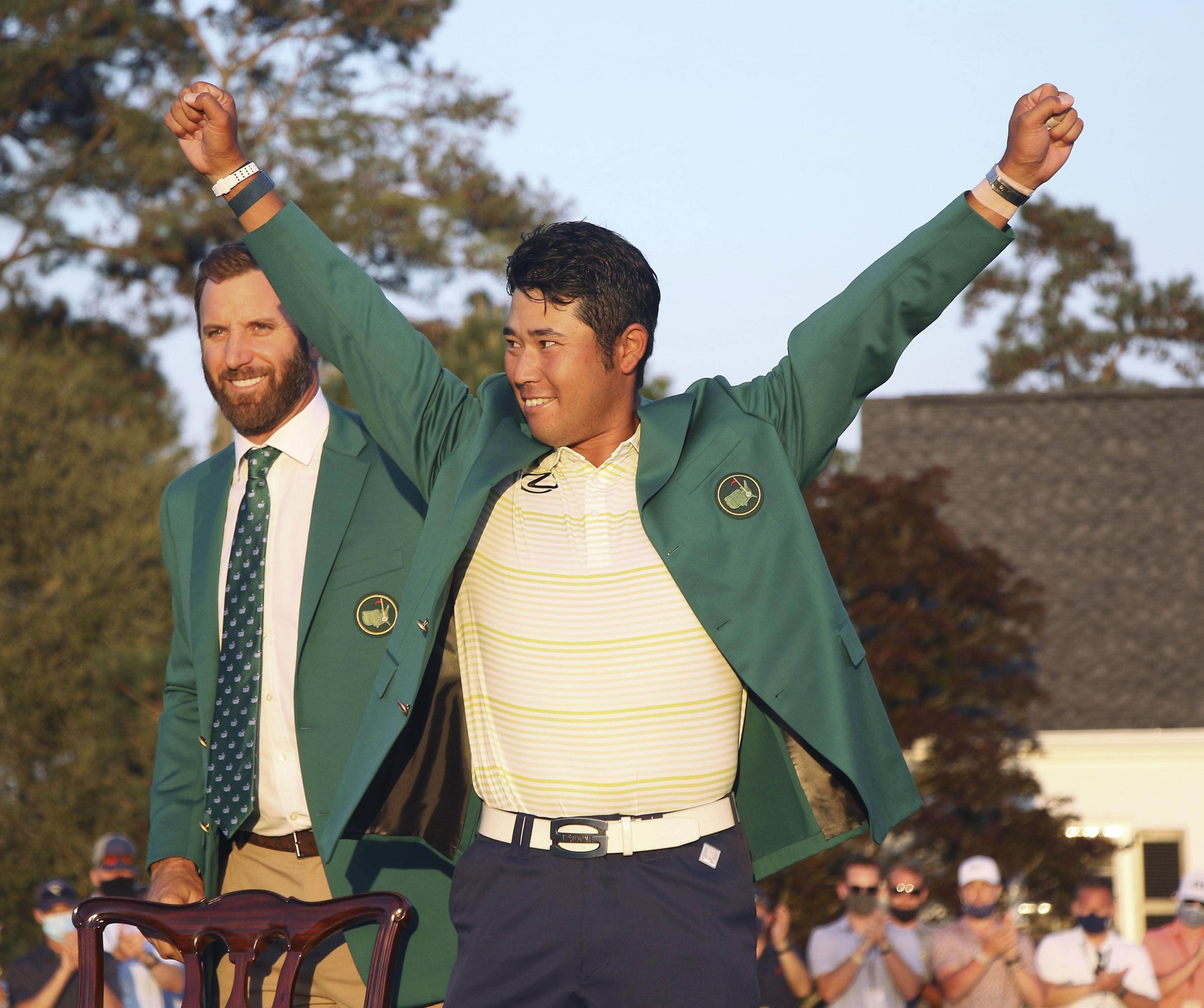 Japanese golfer Hideki Matsuyama celebrates after being presented with the green jacket after winning the Masters at Augusta. Photo: Kyodo