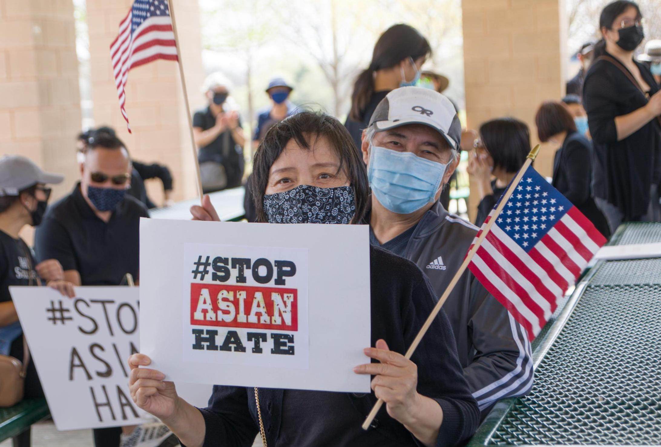 People hold signs at a Stop Asian Hate rally in Plano, Texas, on March 27. Photo: Xinhua