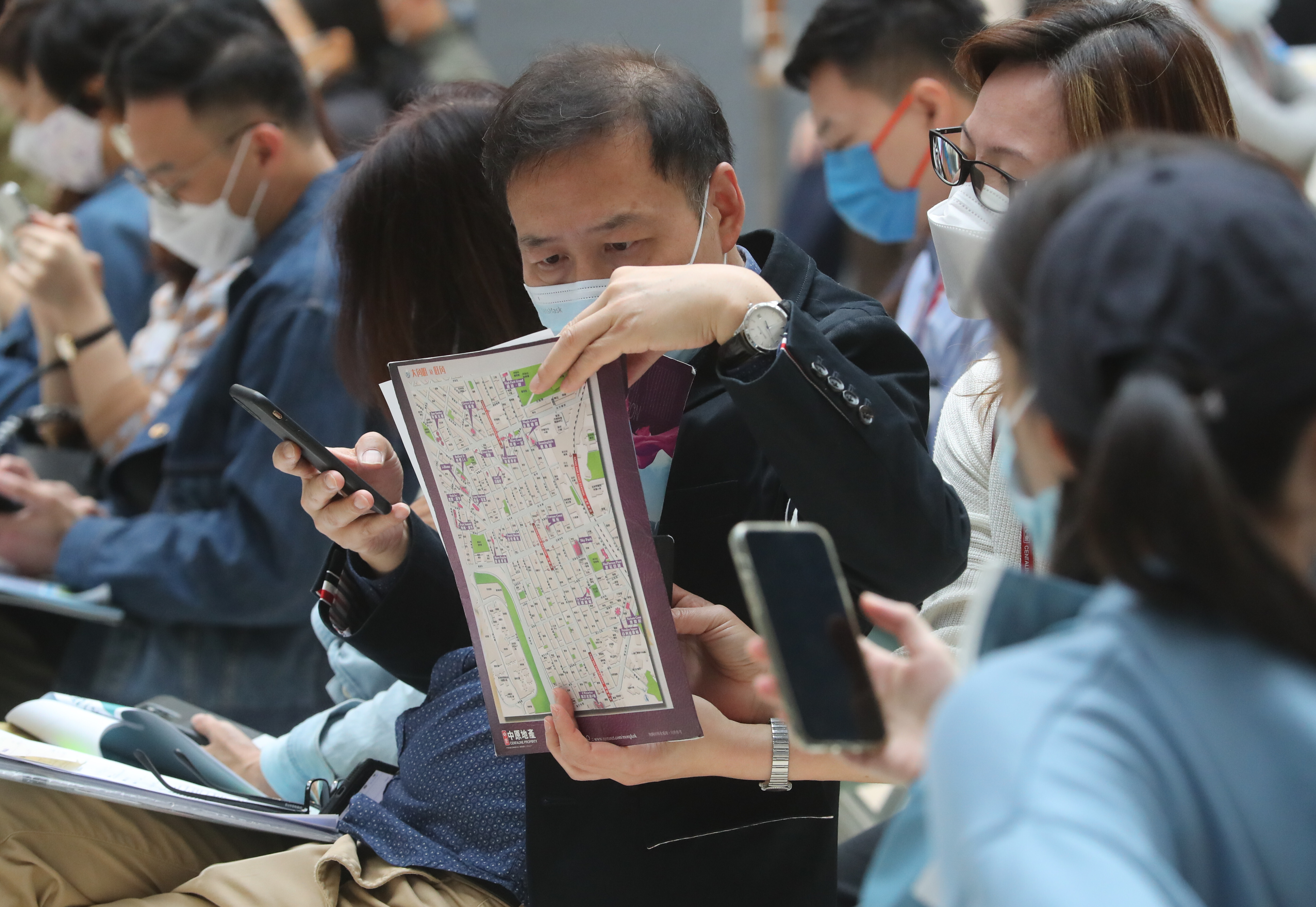 Buyers at a sales office in Hong Kong. Consumers should do more research and comparison on information contained in property advertisements. Photo: Edmond So
