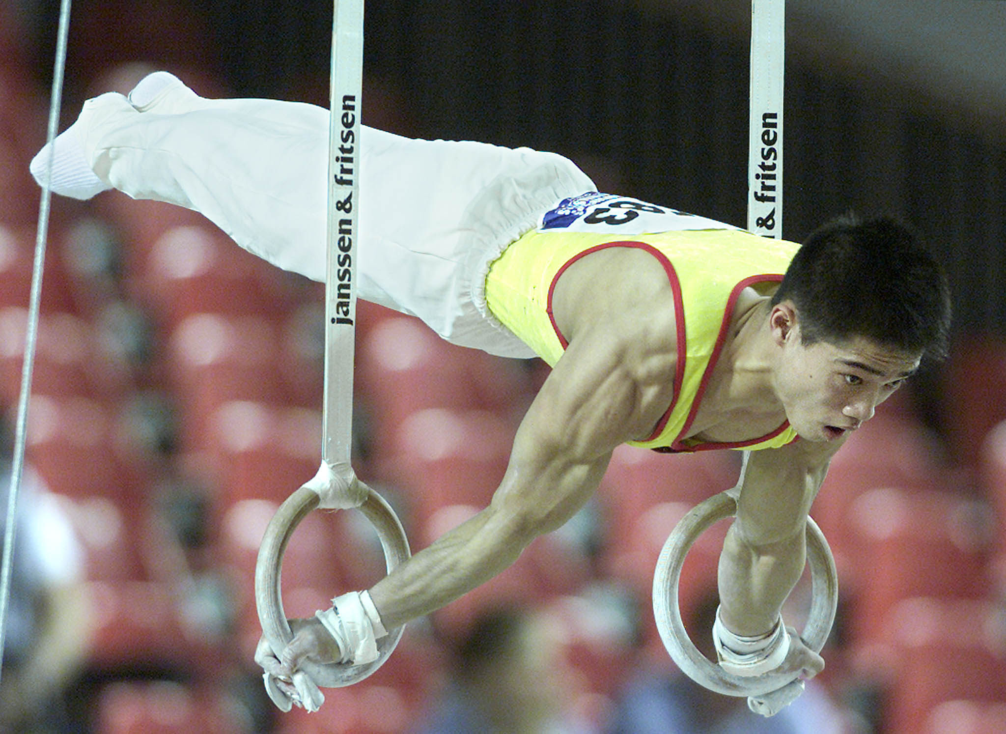 Zhang Shangwu performs on the rings at the World Artistic Gymnastic Championships in Ghent in 2001. Photo: Reuters