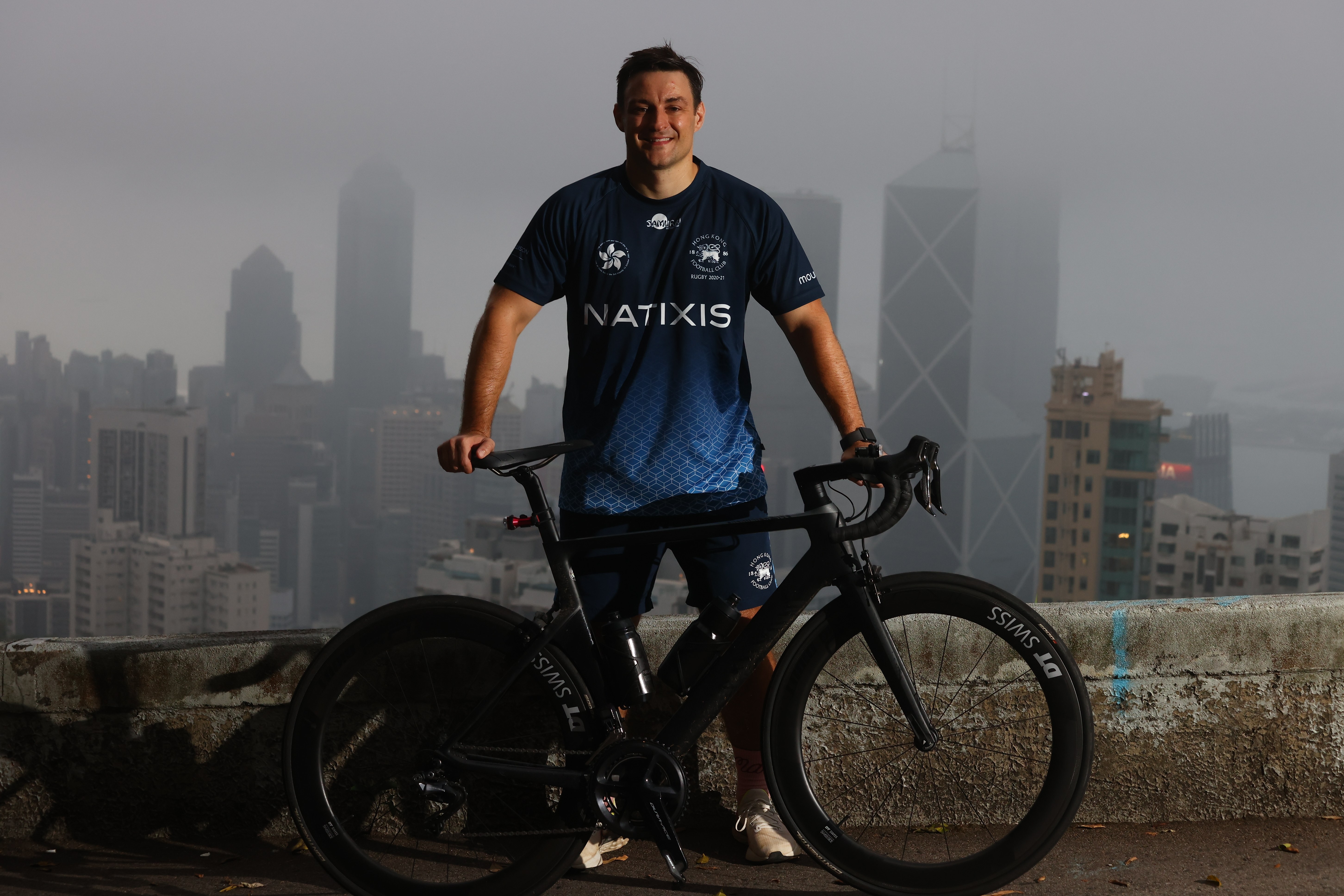 Hong Kong Football Club senior rugby player John McCormick-Houston with his bike on Magazine Gap, Mid-levels to raise money for the HKFC Rugby to Hanoi charity programme in April. Photo: SCMP / Dickson Lee  
