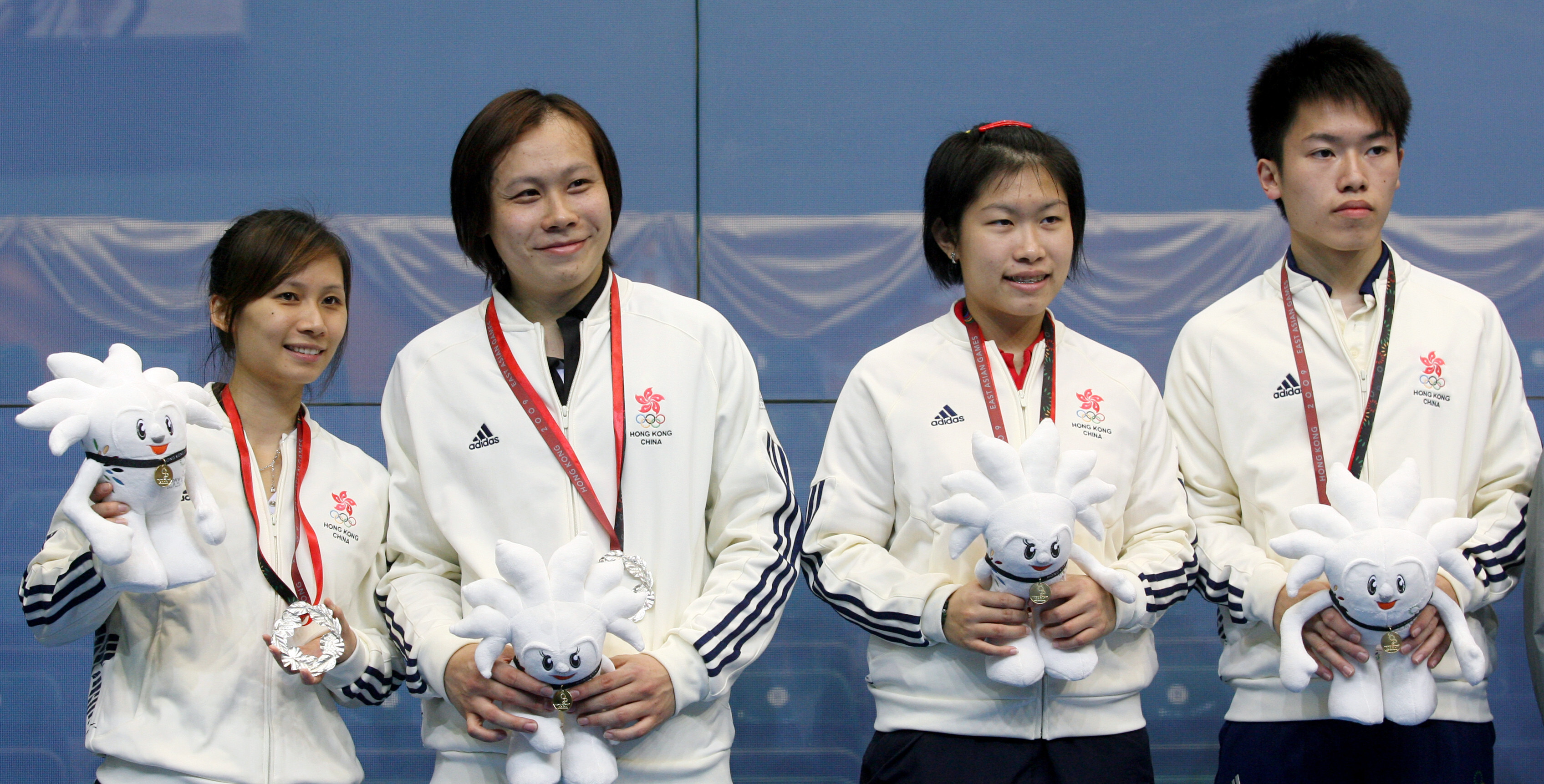 Annie Au Wing-chi (second from right) and younger brother Leo Au Chun-ming captured the mixed doubles gold medal for Hong Kong at 2009 East Asian Games while Rebecca Chiu Wing-yin (left) and Roger Ngan Lun-cheung are second for silver. SCMP pictures.