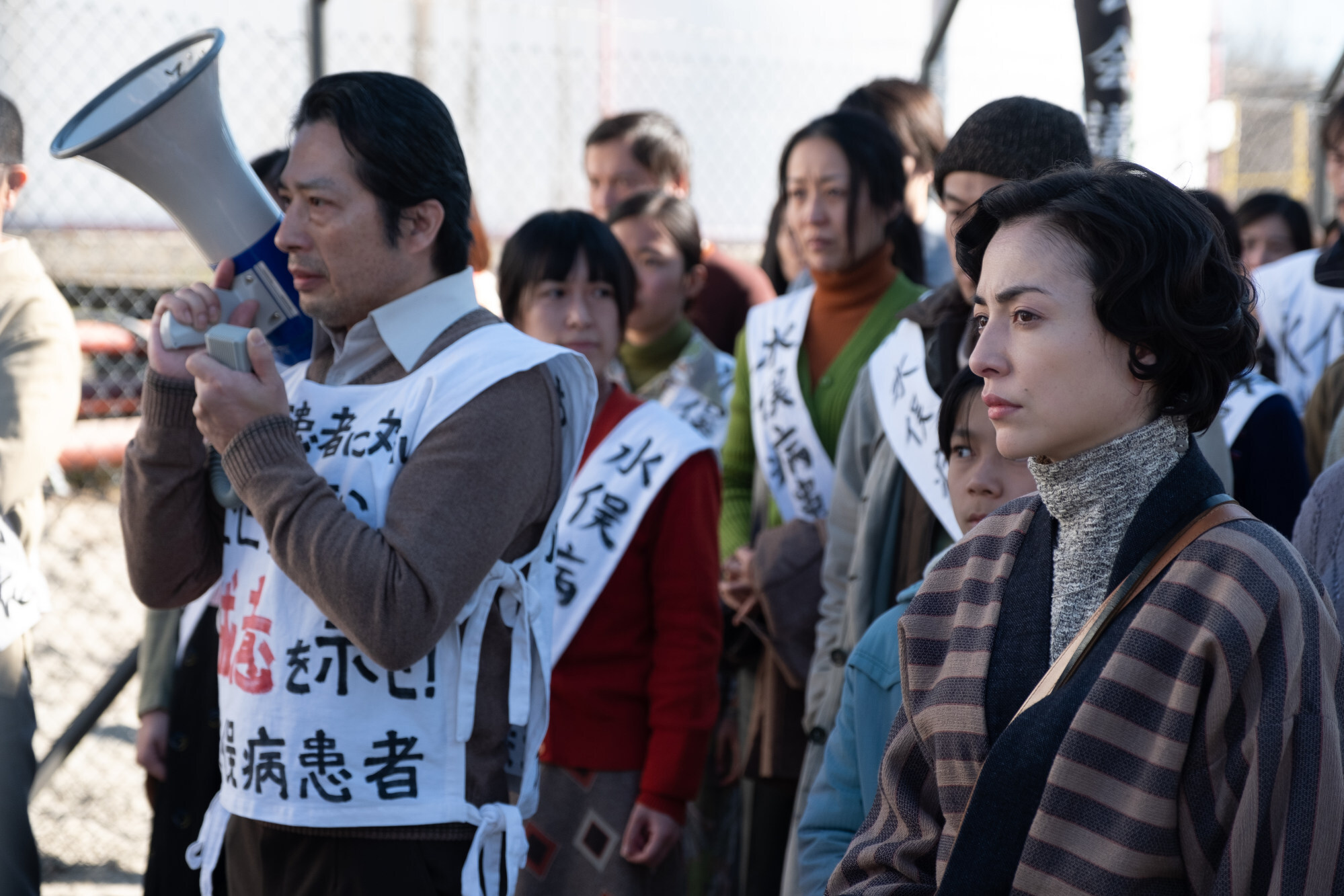 Hiroyuki Sanada (left) and Minami in a scene from Minamata.