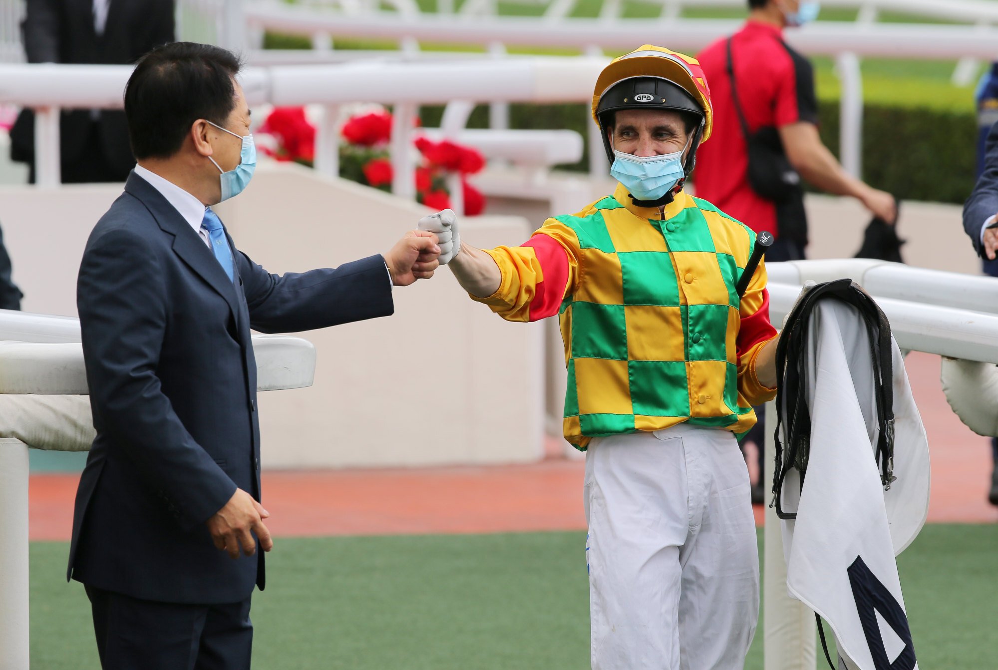 Jockey Neil Callan celebrates with trainer Ricky Yiu after Mighty Giant’s win in the Chairman’s Trophy. 