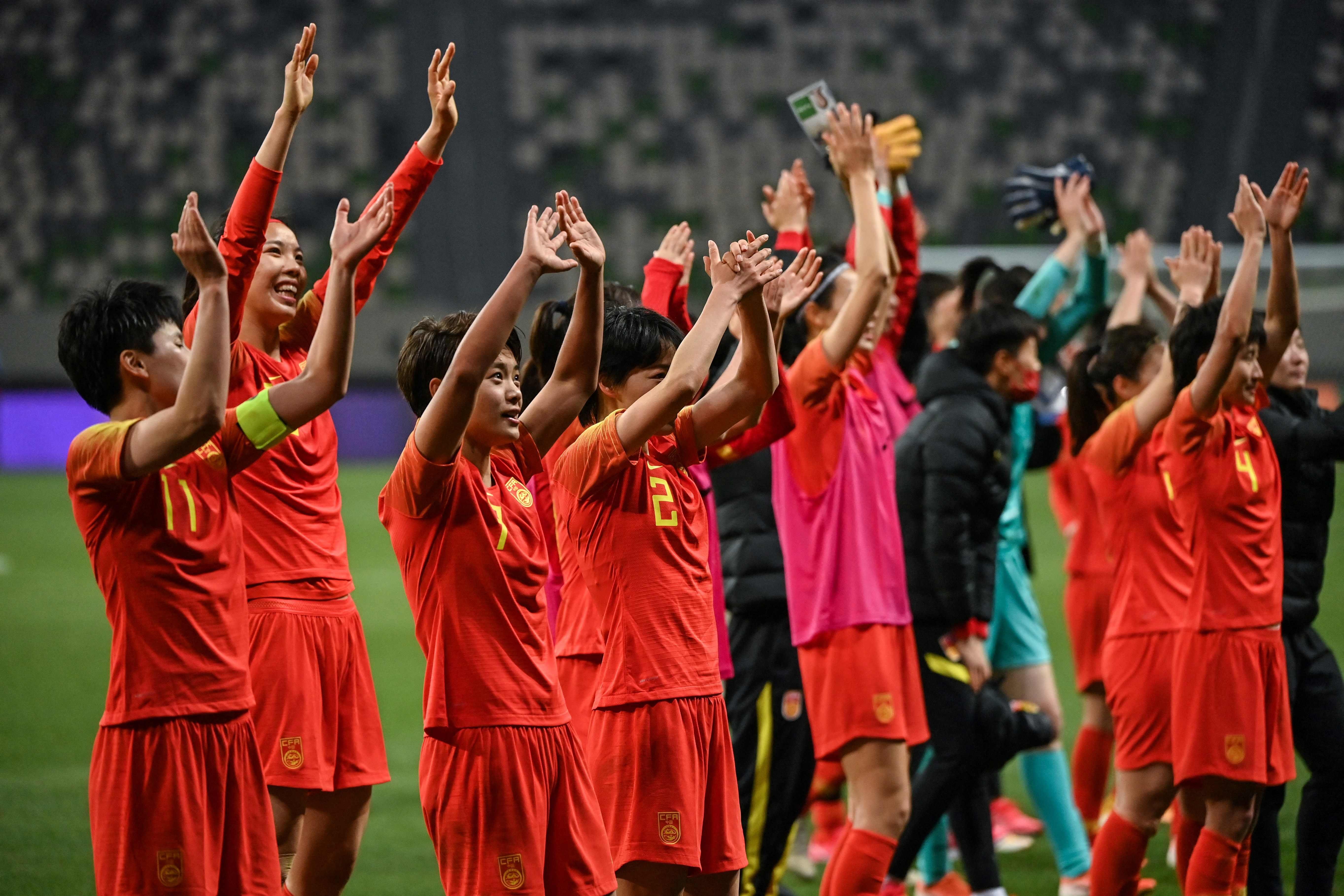 China’s women’s national football team celebrate their victory over South Korea to seal their place at the Tokyo 2020 Olympic Games. Photo: AFP