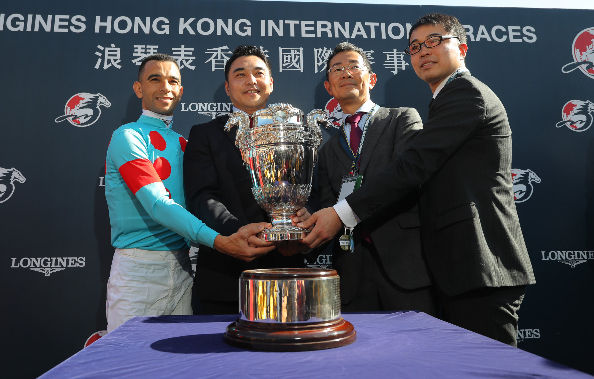 Trainer Tomohito Ozeki (second from right) celebrates Glory Vase’s Hong Kong Vase victory with connections.