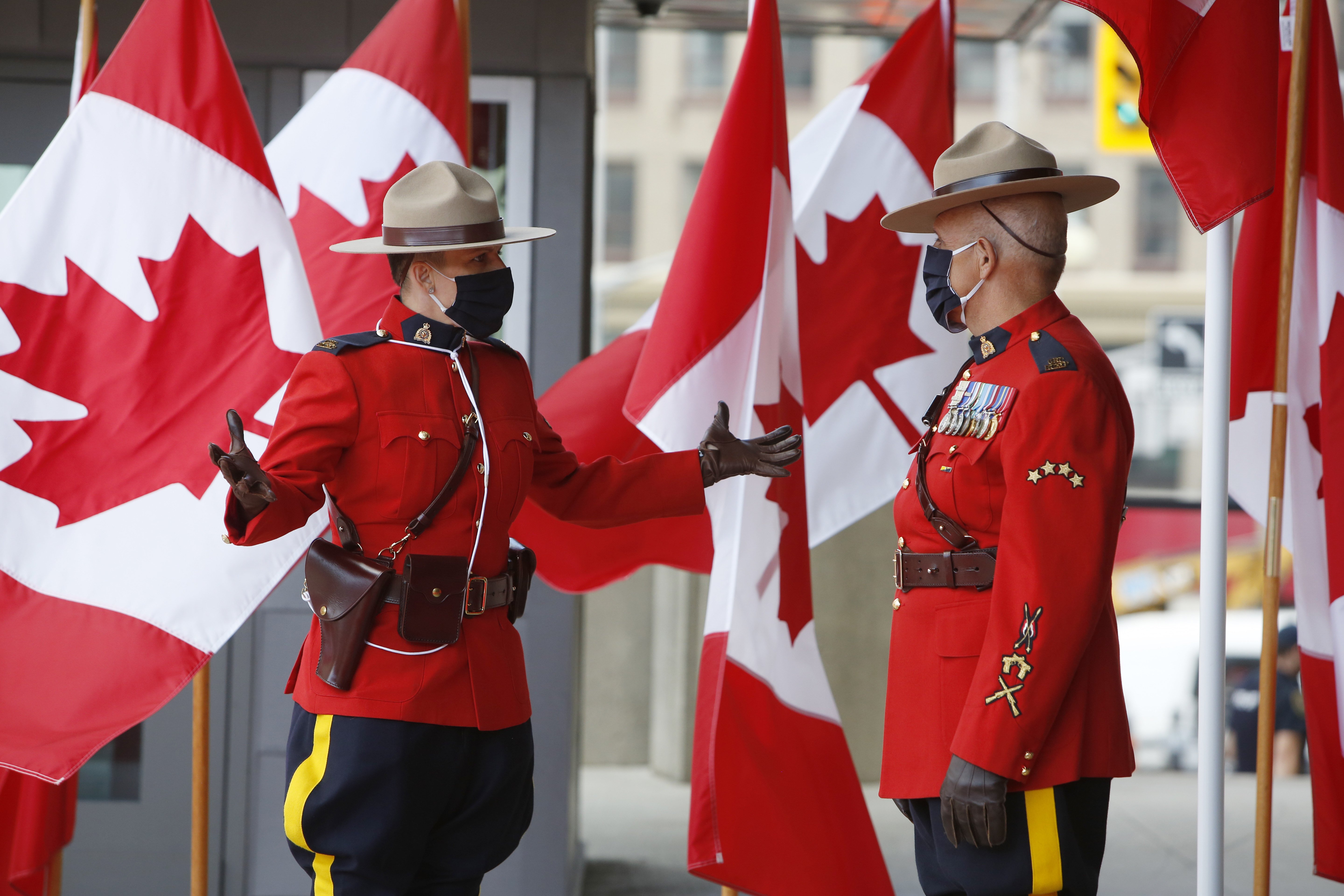 Royal Canadian Mounted Police officers wearing masks stand outside the Senate of Canada in Ottawa, Ontario, in September 2020. Many police forces in Ontario have resisted a re-introduction of street checks to combat Covid-19. Photo: Bloomberg 