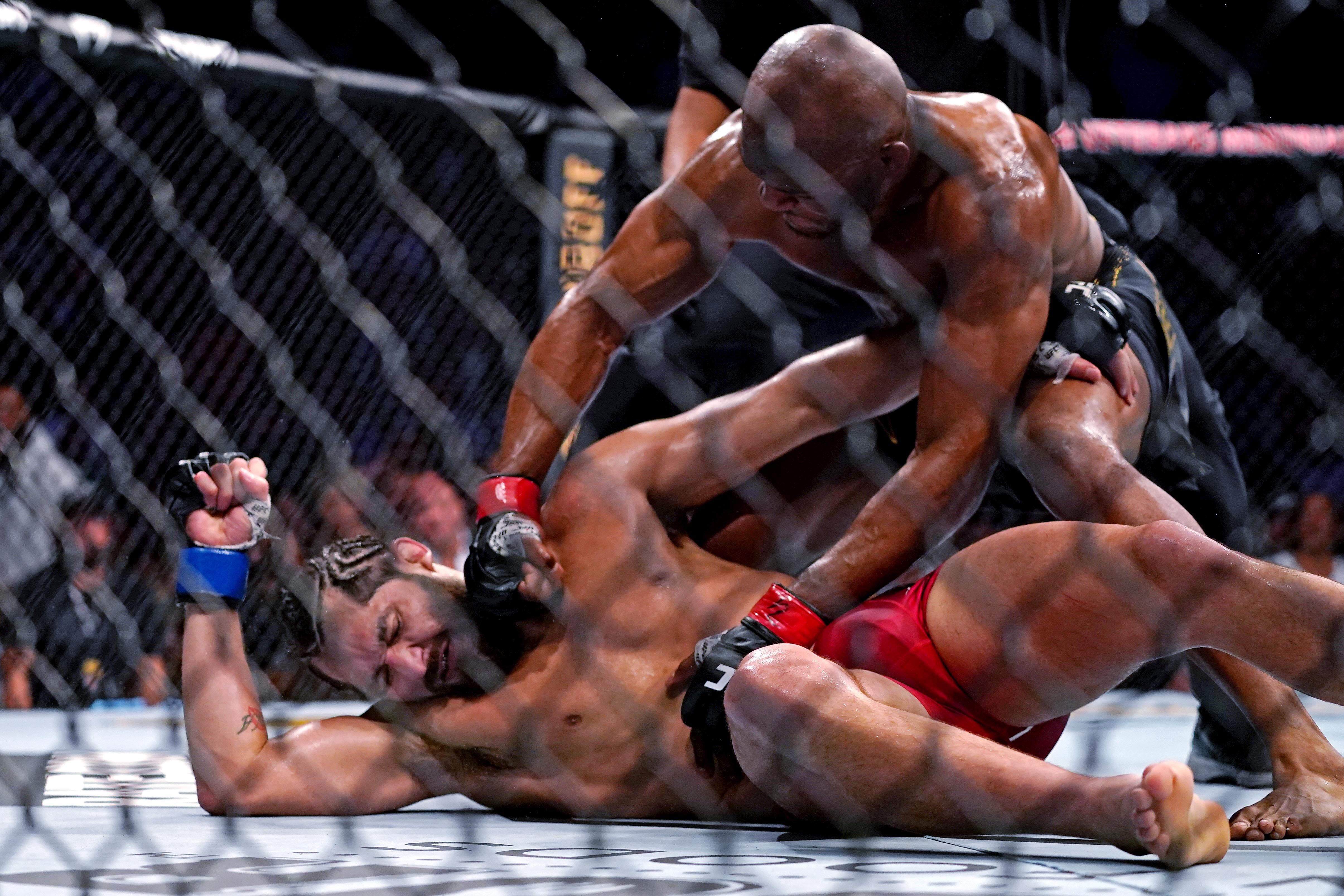 Kamaru Usman lands extra shots after knocking out Jorge Masvidal at UFC 261. Photo: Jasen Vinlove/USA TODAY Sports