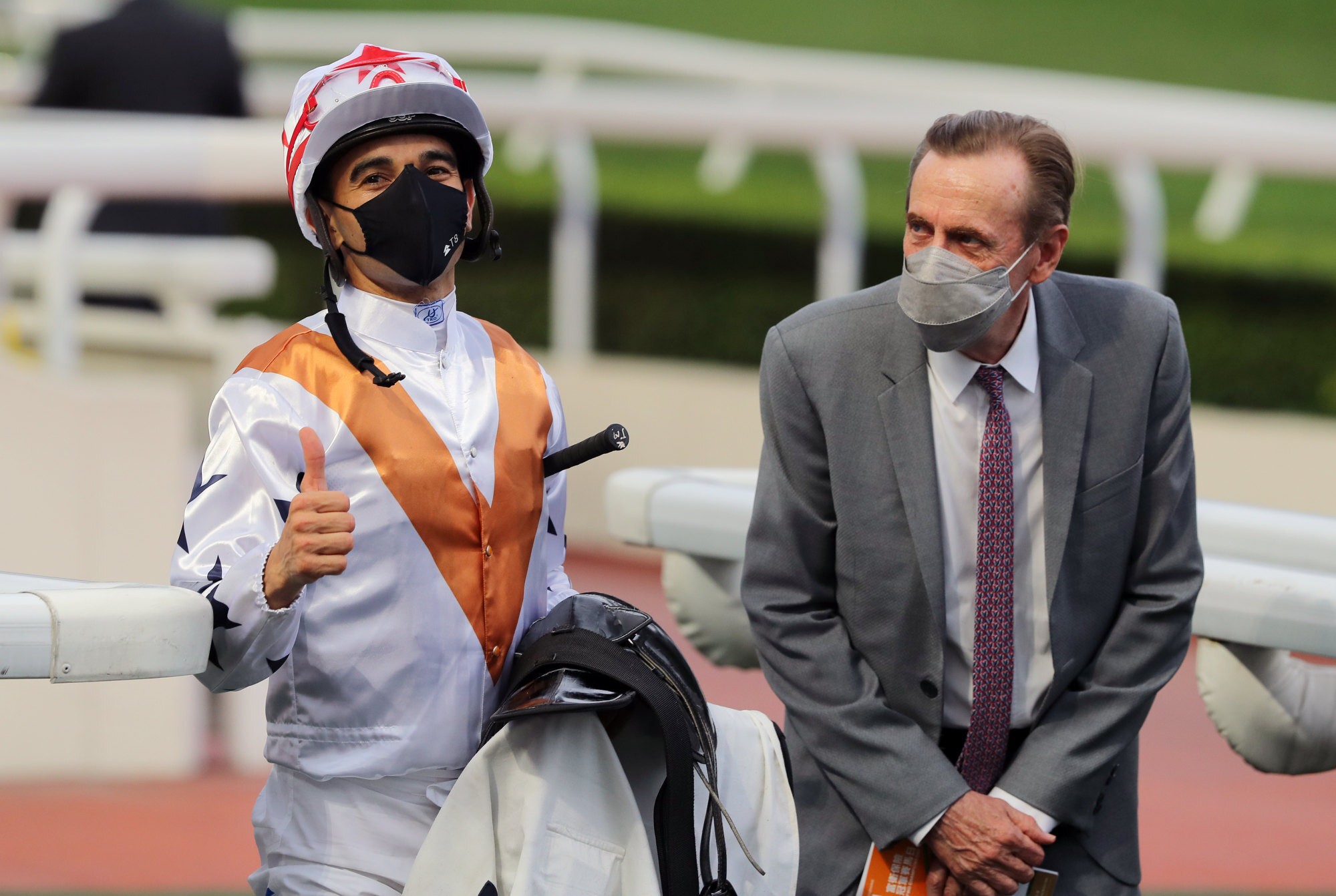 Jockey Joao Moreira and trainer John Size after Courier Wonder’s victory.